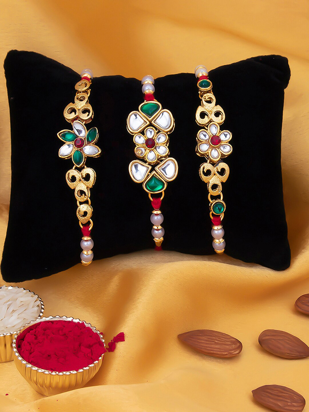 Sukkhi Rakhi Men Set Of 3 Gold-Plated White & Red Stone-Studded & Beaded Rakhi With Roli Chawal & Greeting Card
Sukkhi Rakhi Men Set Of 3 Gold-Plated White & Red Stone-Studded & Beaded Rakhi With Roli Chawal & Greeting Card