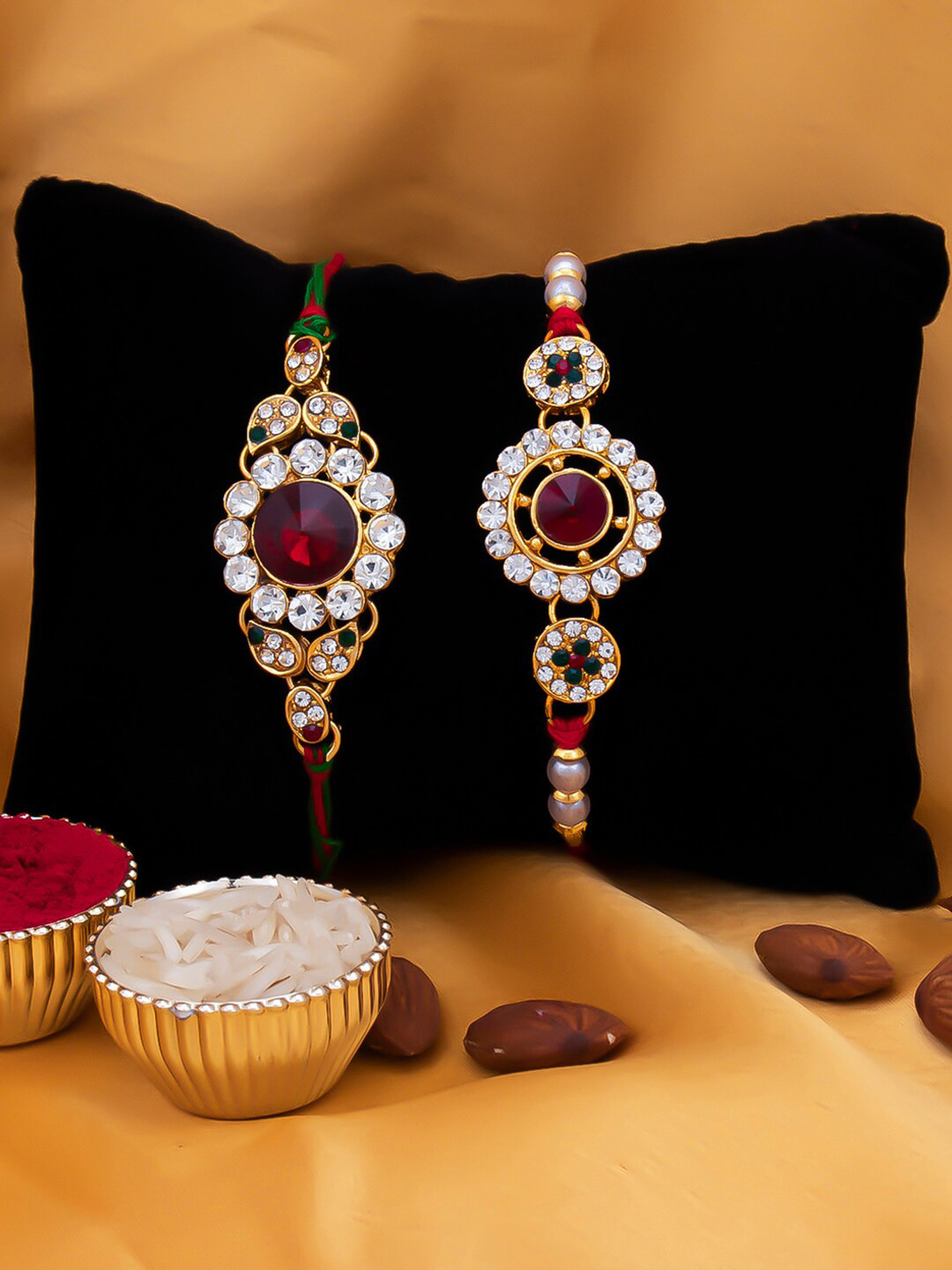 Sukkhi Rakhi Men Set Of 2 Red & White Stone-Studded Rakhi With Roli Chawal & Greeting Card, Gold
Sukkhi Rakhi Men Set Of 2 Red & White Stone-Studded Rakhi With Roli Chawal & Greeting Card, Gold
