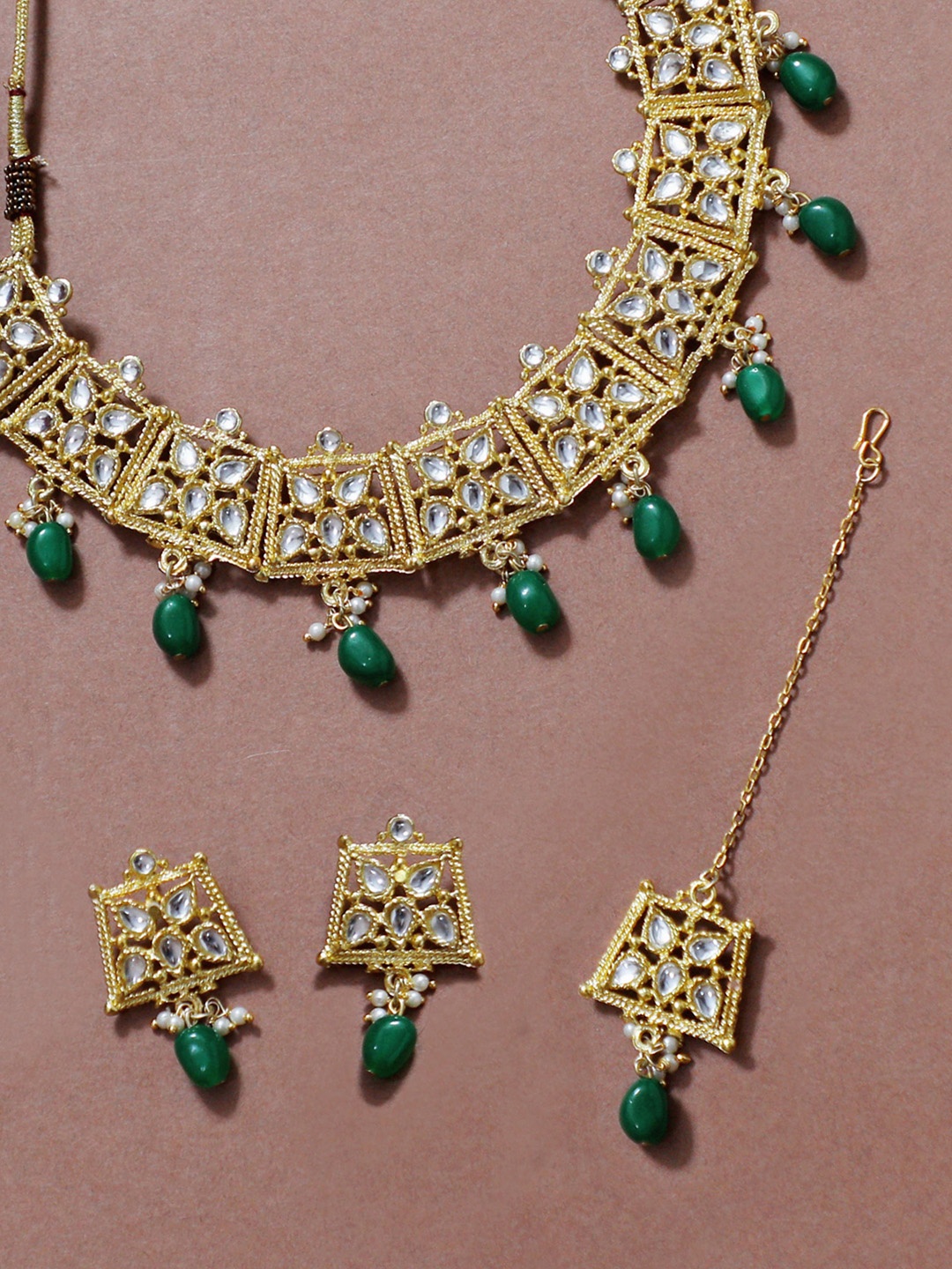 KARATCART Gold-Plated White & Green Kundan-Studded & Beaded Handcrafted Jewellery Set
KARATCART Gold-Plated White & Green Kundan-Studded & Beaded Handcrafted Jewellery Set
