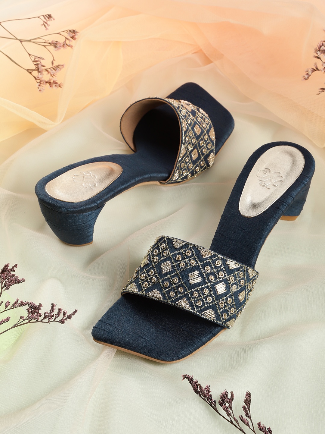 House of Pataudi Navy Blue & Gold-Toned Embroidered Handcrafted Open Toe Block Heels
House of Pataudi Navy Blue & Gold-Toned Embroidered Handcrafted Open Toe Block Heels