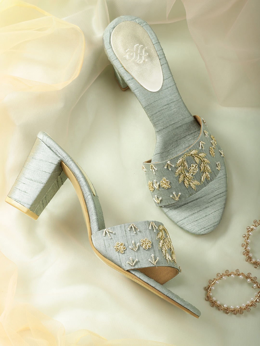 House of Pataudi Sea Green & Gold-Toned Embroidered Handcrafted Open Toe Block Heels
House of Pataudi Sea Green & Gold-Toned Embroidered Handcrafted Open Toe Block Heels