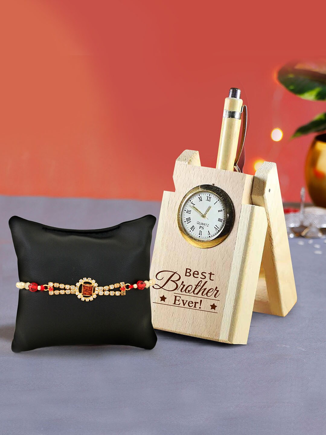 TIED RIBBONS Multicoloured Rakhi with Wooden Penstand & Roli Chawal Combo Pack, Multi
TIED RIBBONS Multicoloured Rakhi with Wooden Penstand & Roli Chawal Combo Pack, Multi