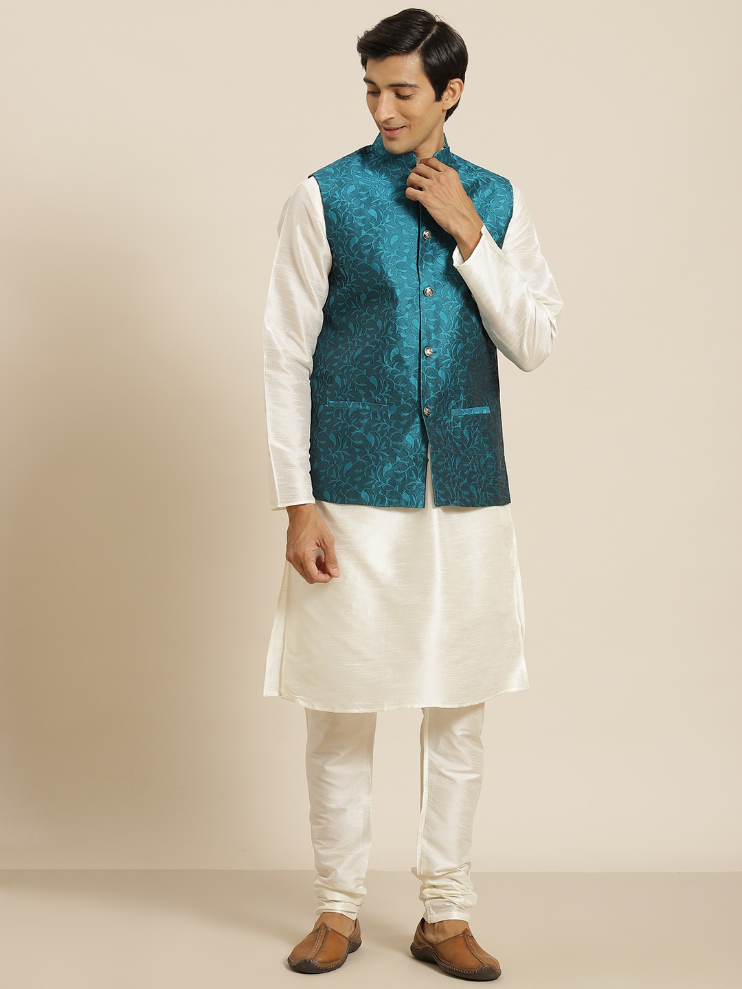 SOJANYA Men Off White & Teal Green Motifs Design Kurta with Churidar and Nehru Jacket
SOJANYA Men Off White & Teal Green Motifs Design Kurta with Churidar and Nehru Jacket