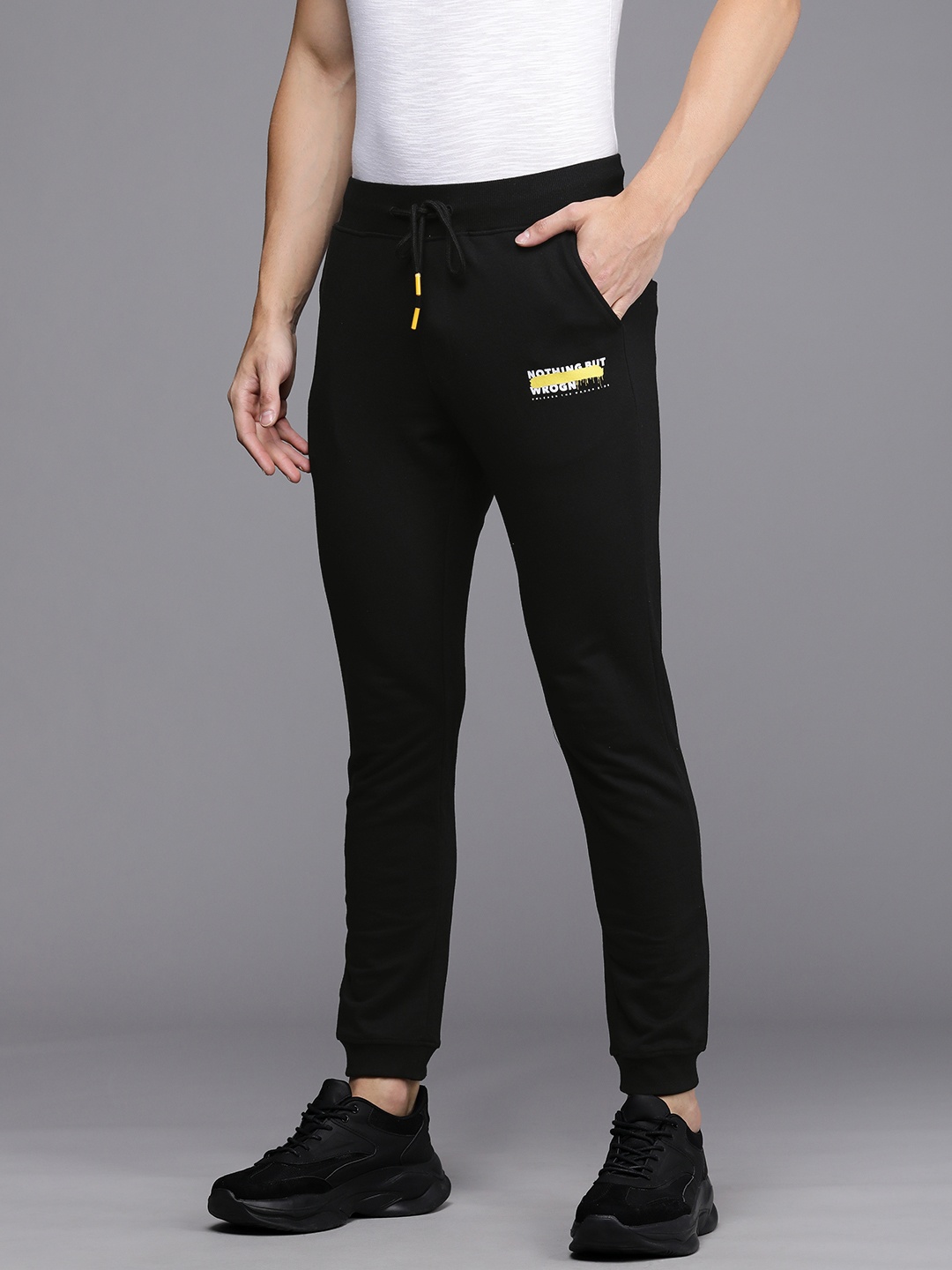 WROGN Men Black Solid Slim Fit Mid-Rise Knitted Joggers with Typography Print Detail
WROGN Men Black Solid Slim Fit Mid-Rise Knitted Joggers with Typography Print Detail