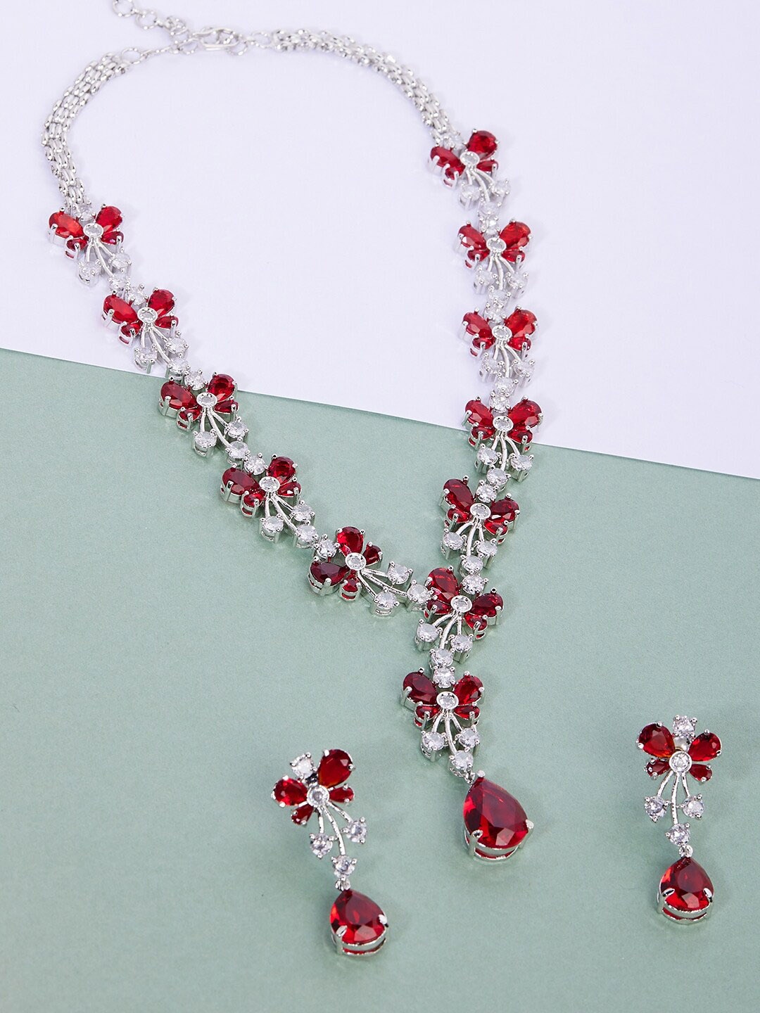 GloBox By ZeroKaata Rhodium-Plated Silver-Toned & Red AD-Studded Handcrafted Jewellery Set
GloBox By ZeroKaata Rhodium-Plated Silver-Toned & Red AD-Studded Handcrafted Jewellery Set