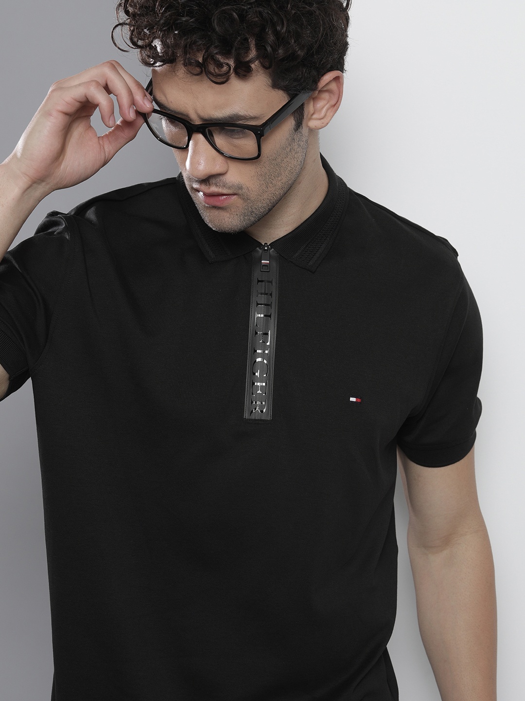 Tommy Hilfiger Men Black Solid Polo Collar Brand Logo Zip Interlock Pure Cotton T-shirt
Tommy Hilfiger Men Black Solid Polo Collar Brand Logo Zip Interlock Pure Cotton T-shirt