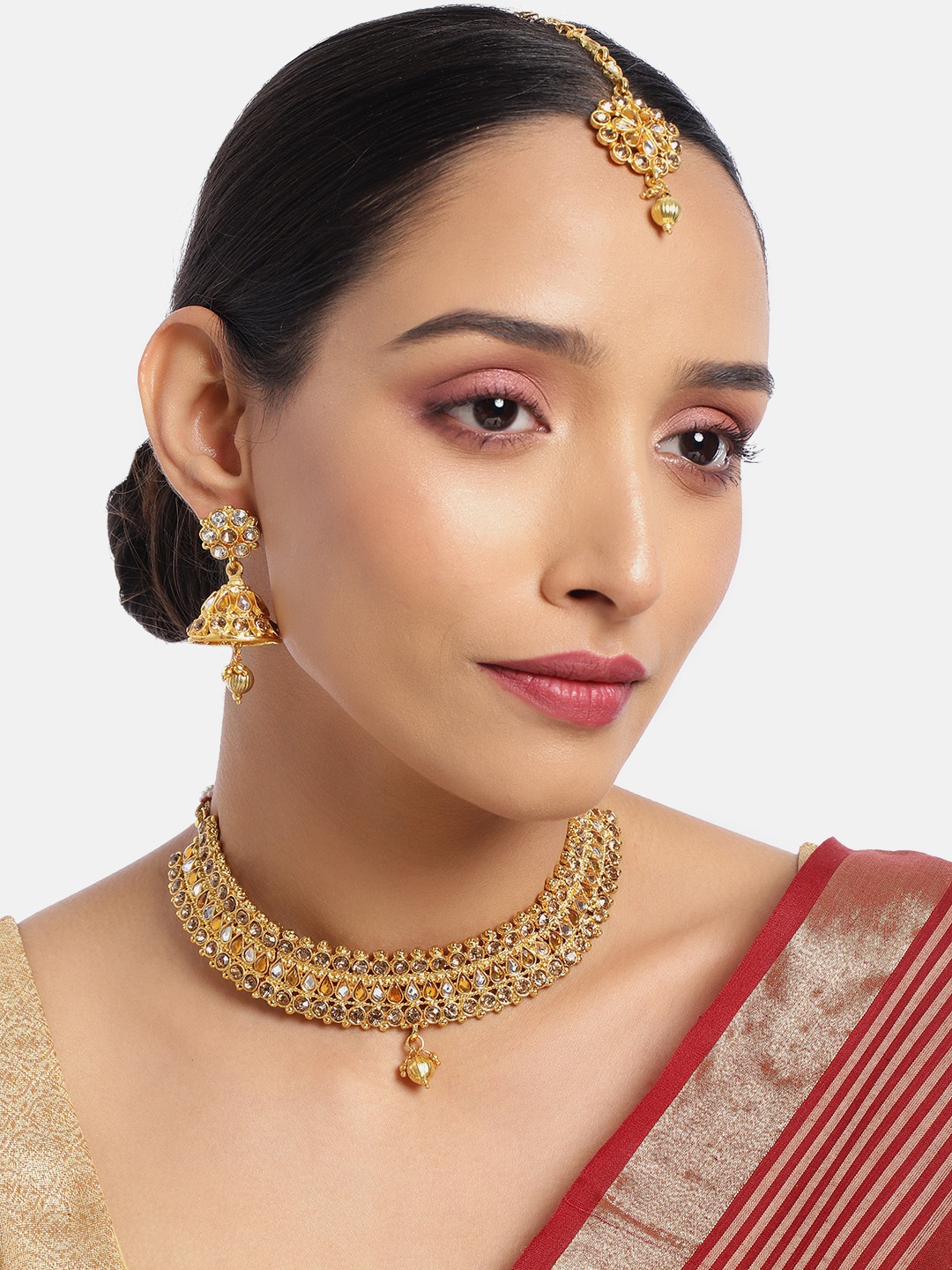 ASMITTA JEWELLERY Women Gold-Toned Kundan Studded Choker Necklace Set with Maang Tika
ASMITTA JEWELLERY Women Gold-Toned Kundan Studded Choker Necklace Set with Maang Tika
