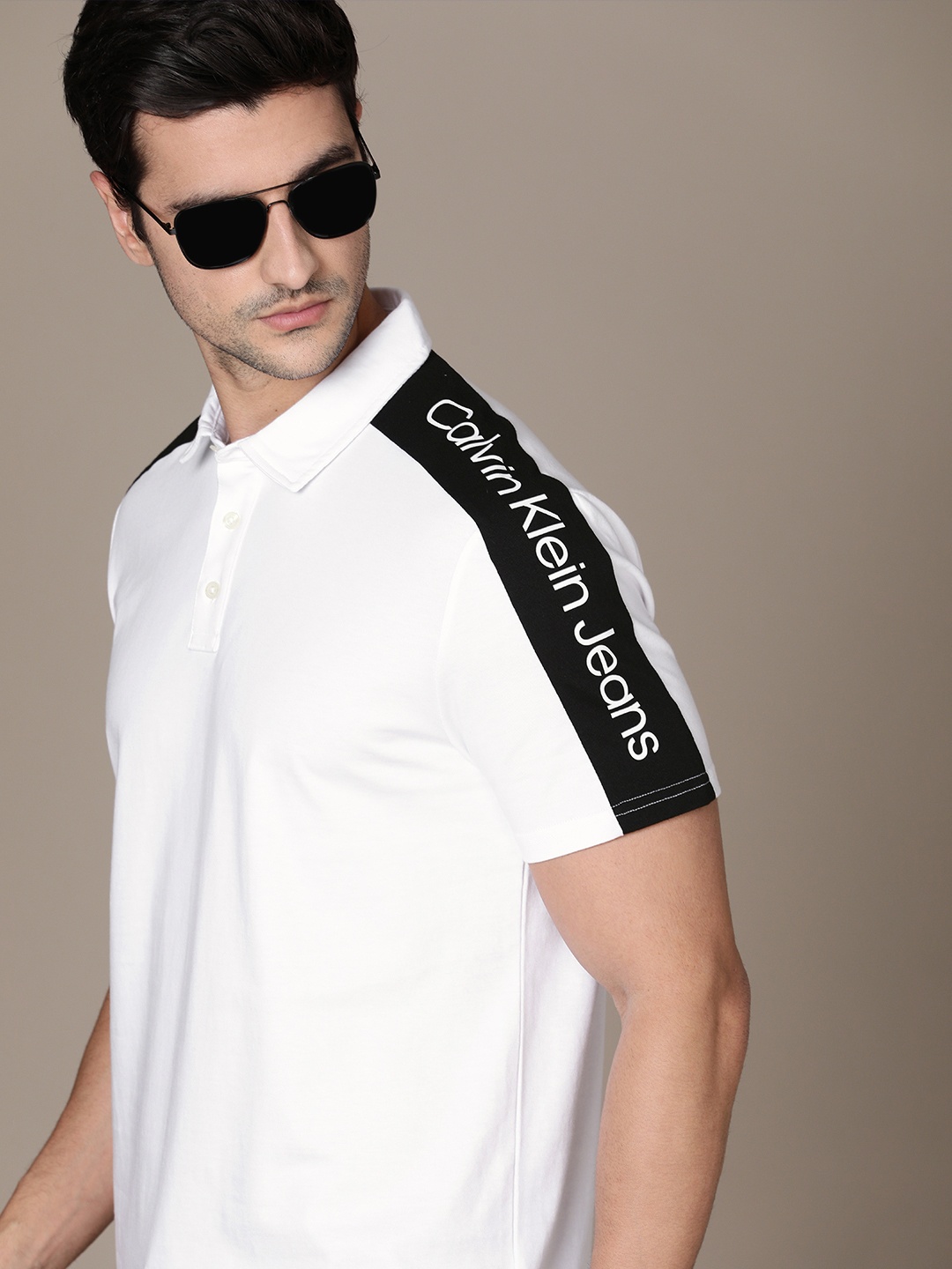 Calvin Klein Jeans Men White Solid Pure Cotton T-shirt With Black Typography Sleeve Stripe
Calvin Klein Jeans Men White Solid Pure Cotton T-shirt With Black Typography Sleeve Stripe