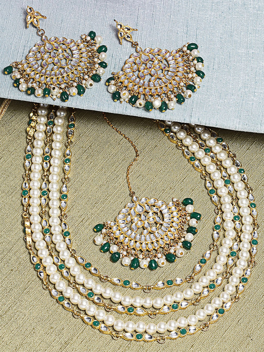 KARATCART Gold-Plated White & Green Kundan-Studded & Pearl Beaded Handcrafted Jewellery Set
KARATCART Gold-Plated White & Green Kundan-Studded & Pearl Beaded Handcrafted Jewellery Set