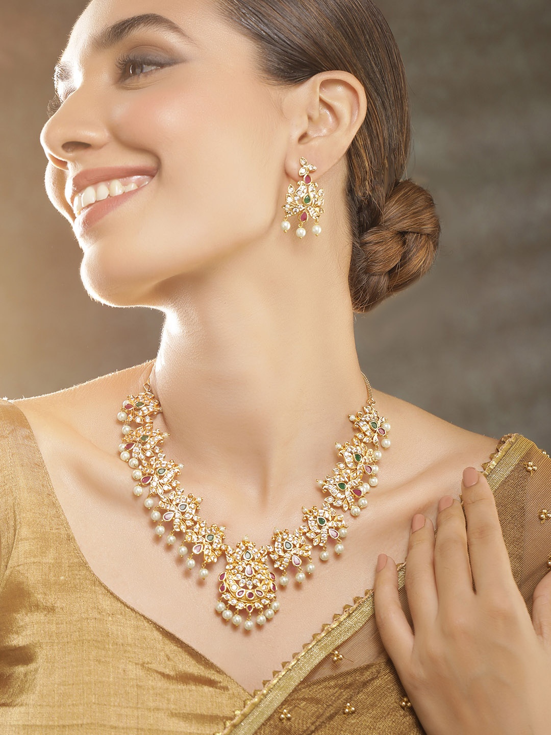Rubans 24K Gold-Plated Ruby Pink & Emerald CZ Studded Pearl Beaded Temple Jewellery Set
Rubans 24K Gold-Plated Ruby Pink & Emerald CZ Studded Pearl Beaded Temple Jewellery Set
