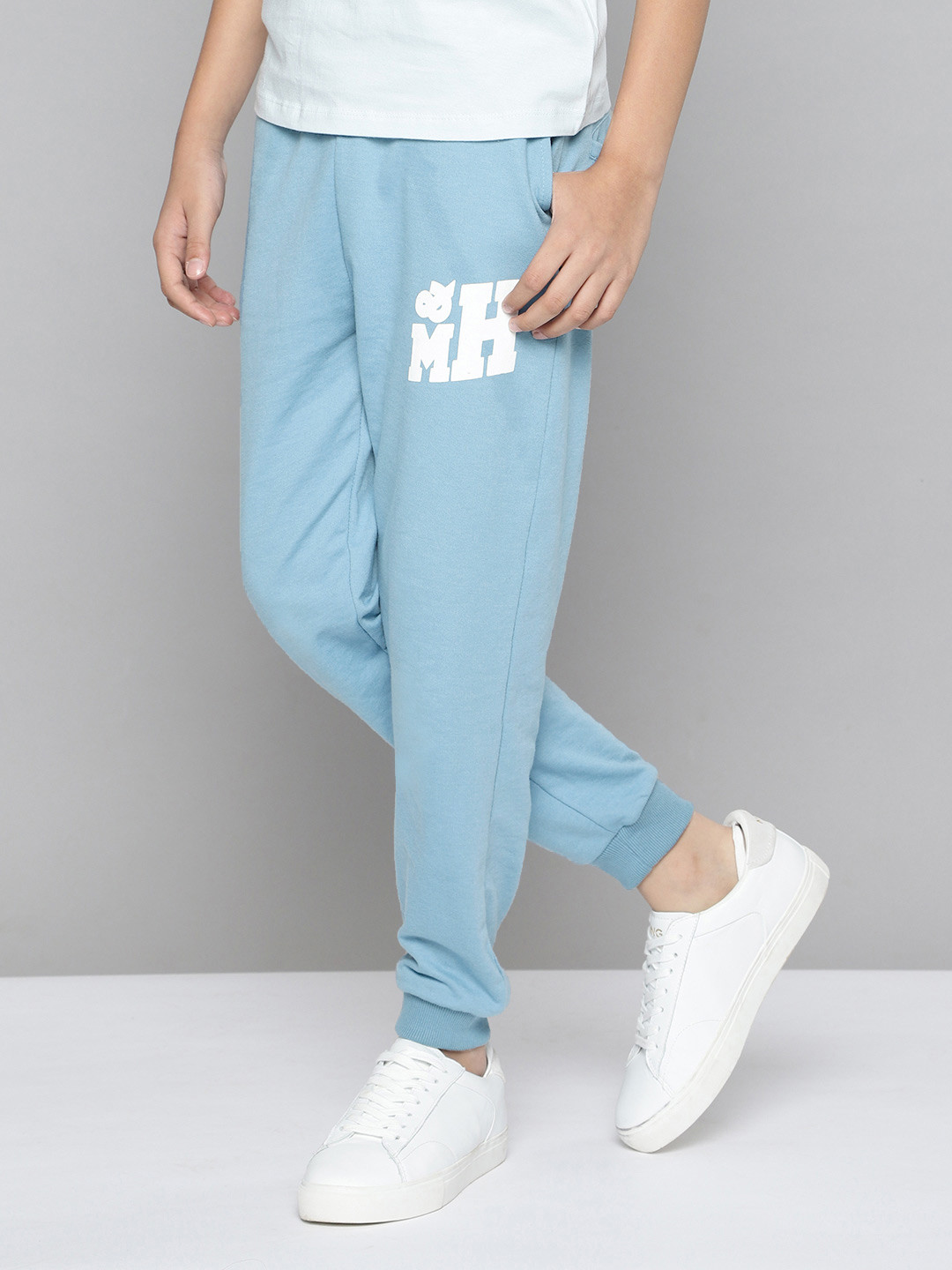 M&H Juniors Boys Blue Solid Joggers with Brand Logo Print Detail
M&H Juniors Boys Blue Solid Joggers with Brand Logo Print Detail