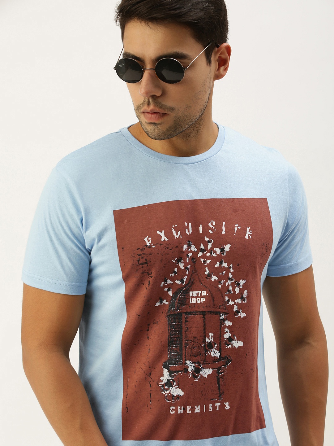 Peter England Men Light Blue Brick Red Graphic Printed Slim Fit Cotton Casual Pure Cotton T-shirt
Peter England Men Light Blue Brick Red Graphic Printed Slim Fit Cotton Casual Pure Cotton T-shirt