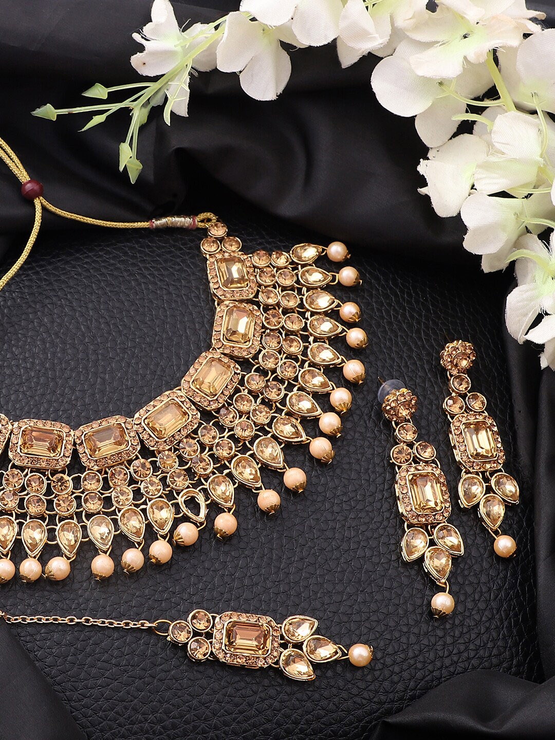 ANIKAS CREATION Gold-Plated Brown Stone-Studded & White Beaded Handcrafted Jewellery Set
ANIKAS CREATION Gold-Plated Brown Stone-Studded & White Beaded Handcrafted Jewellery Set