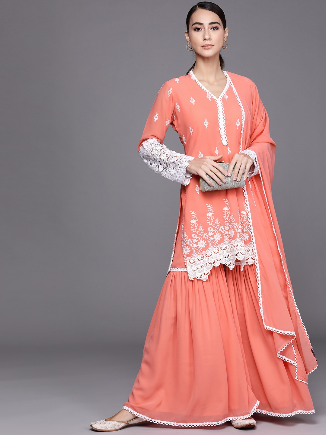 Libas Women Peach-Coloured & White Ethnic Motifs Embroidered Kurta with Sharara & Dupatta
Libas Women Peach-Coloured & White Ethnic Motifs Embroidered Kurta with Sharara & Dupatta