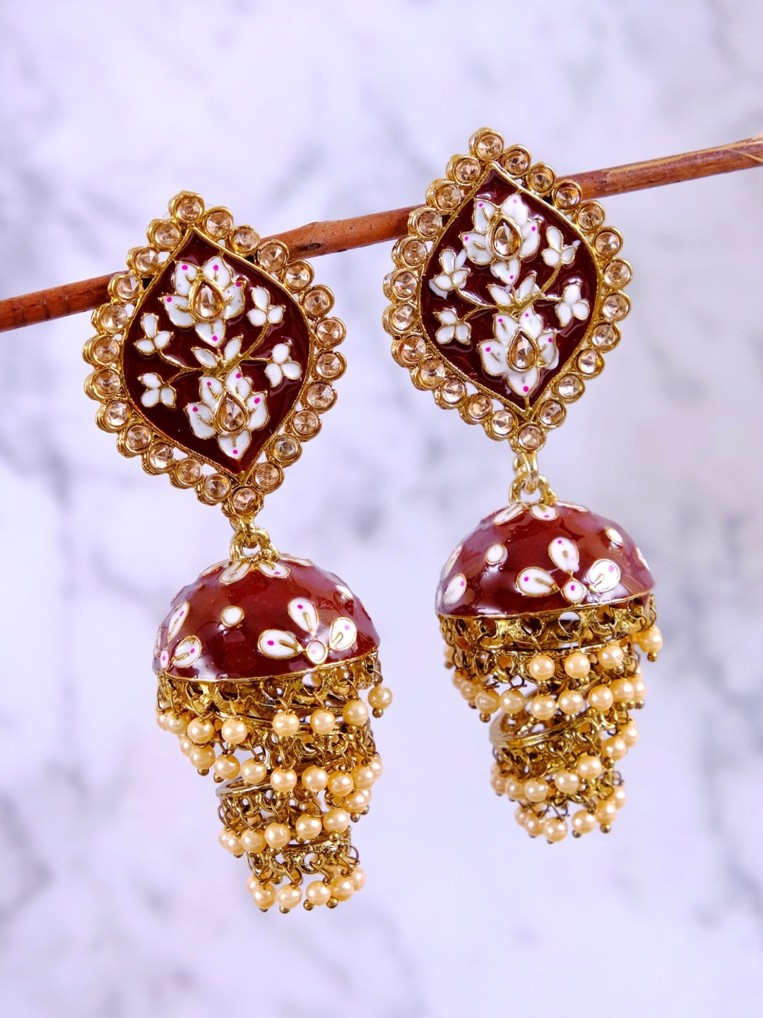 Crunchy Fashion Gold-Plated Gold-Toned & Maroon Meenakari Layered Jhumkas Earrings
Crunchy Fashion Gold-Plated Gold-Toned & Maroon Meenakari Layered Jhumkas Earrings