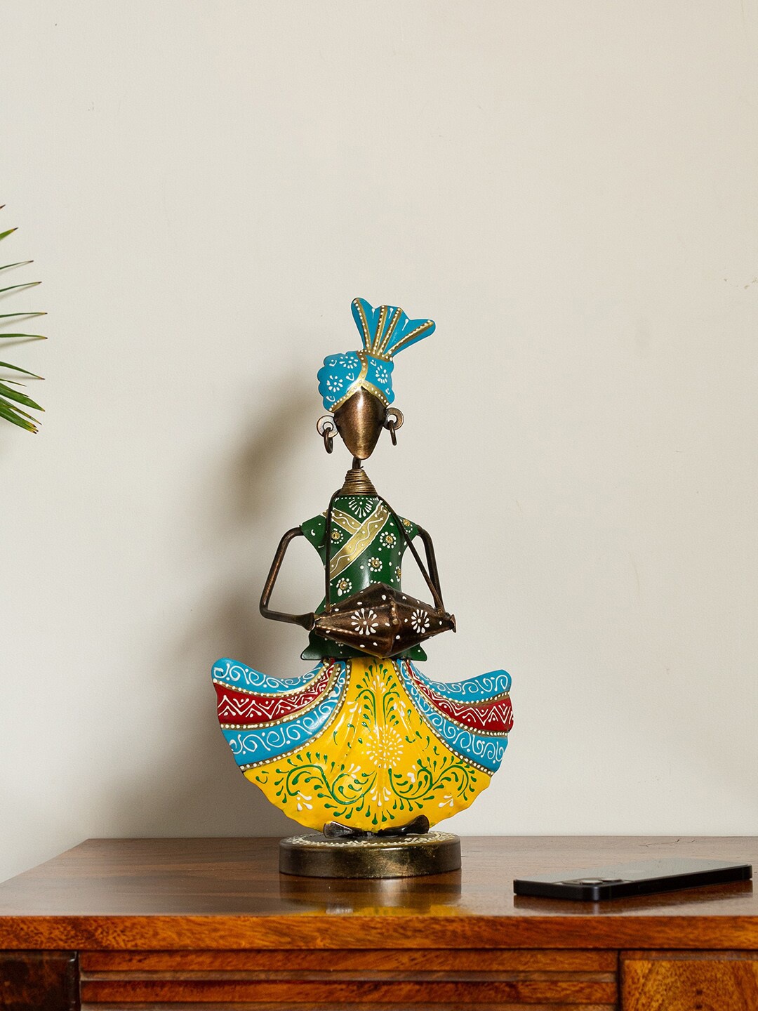 ExclusiveLane Copper-Toned & Yellow Handpainted & Handcrafted Decorative Dholi Folk Artist Showpiece
ExclusiveLane Copper-Toned & Yellow Handpainted & Handcrafted Decorative Dholi Folk Artist Showpiece