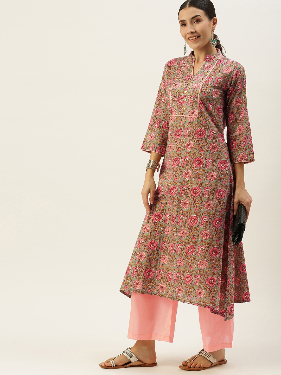 Saanjh Women Green Floral Printed Regular Mirror Work Pure Cotton Kurta with Palazzos
Saanjh Women Green Floral Printed Regular Mirror Work Pure Cotton Kurta with Palazzos