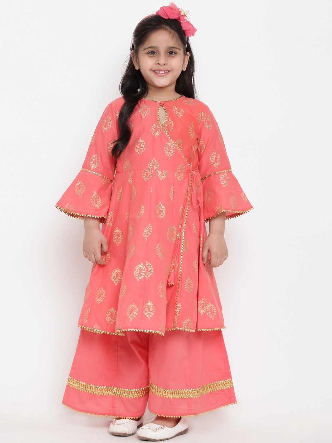 Bitiya by Bhama Girls Peach-Coloured Ethnic Motifs Printed Pure Cotton Kurta with Palazzos
Bitiya by Bhama Girls Peach-Coloured Ethnic Motifs Printed Pure Cotton Kurta with Palazzos