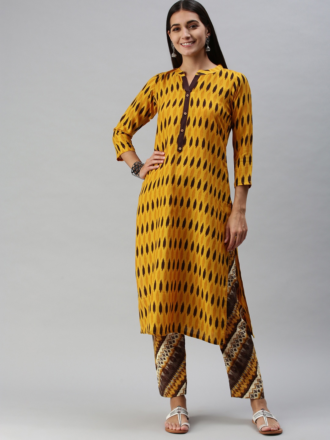 SheWill Women Mustard Yellow Ethnic Motifs Ikat Printed Regular Kurta with Trousers
SheWill Women Mustard Yellow Ethnic Motifs Ikat Printed Regular Kurta with Trousers