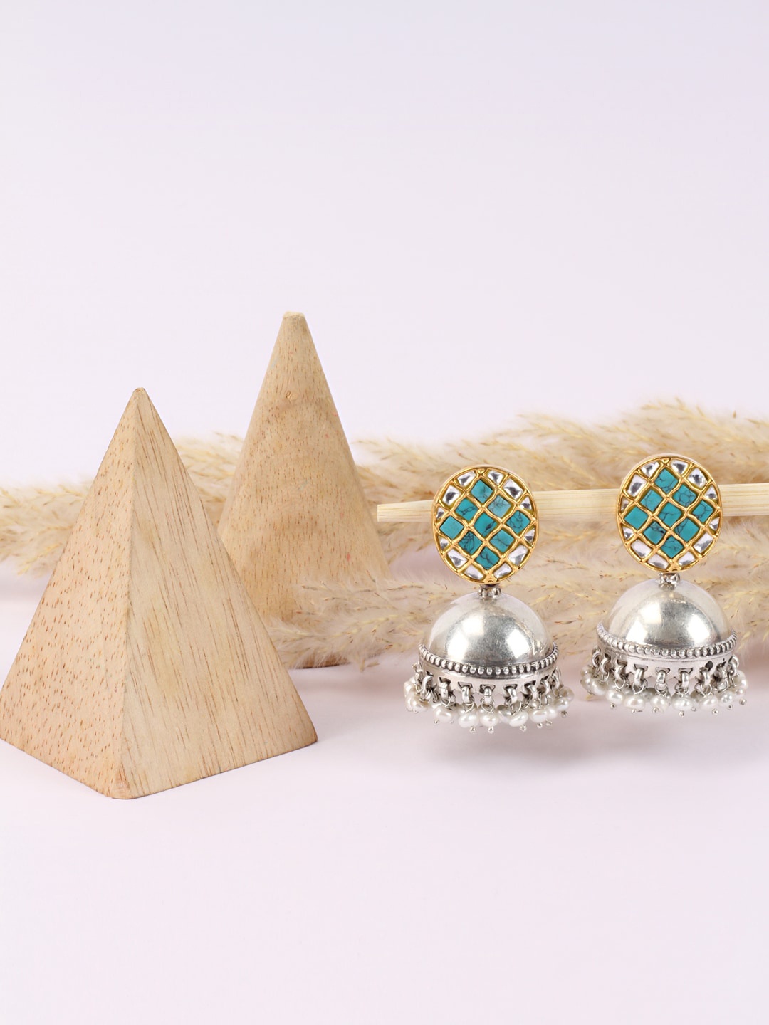 SANGEETA BOOCHRA Silver-Toned & Green Gold-Plated Pearls Dome Shaped Jhumkas Earrings
SANGEETA BOOCHRA Silver-Toned & Green Gold-Plated Pearls Dome Shaped Jhumkas Earrings