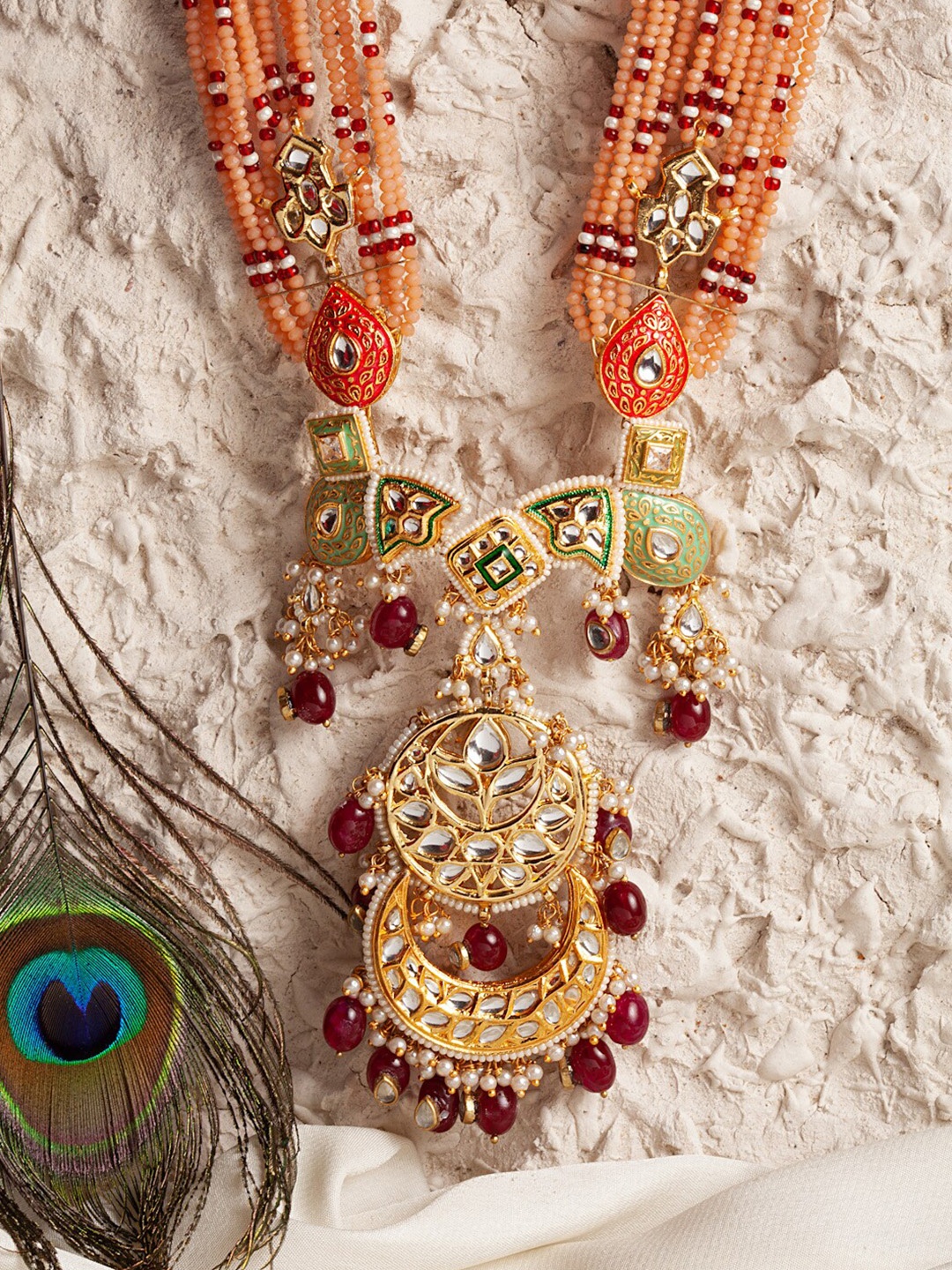 DUGRISTYLE Gold-Toned & Peach-Color Kundan Studded & Beaded Handicrafted Long Necklace
DUGRISTYLE Gold-Toned & Peach-Color Kundan Studded & Beaded Handicrafted Long Necklace