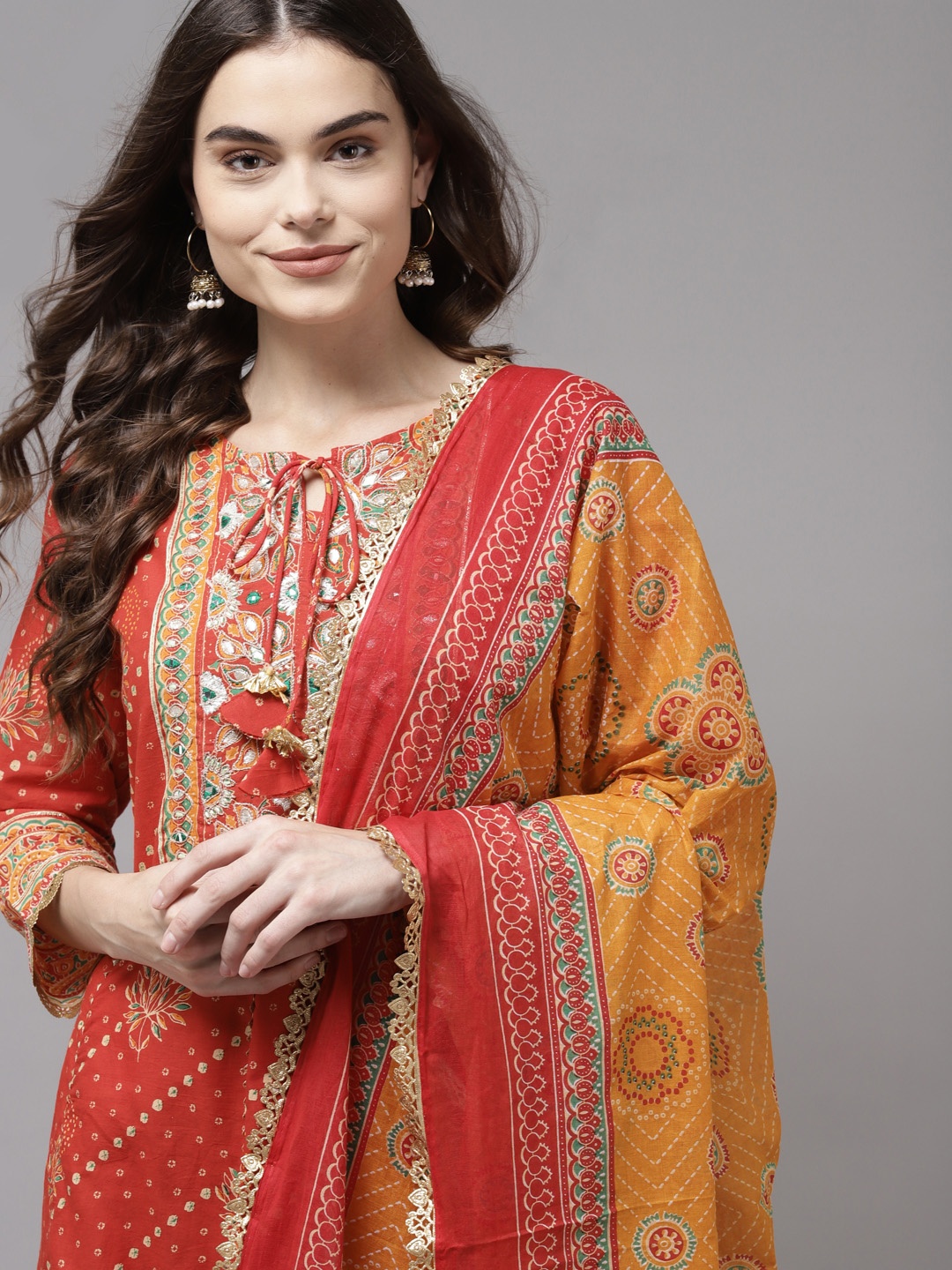 Indo Era Women Red Bandhani Embroidered Panelled Gotta Patti Kurta with Trousers & With Dupatta
Indo Era Women Red Bandhani Embroidered Panelled Gotta Patti Kurta with Trousers & With Dupatta