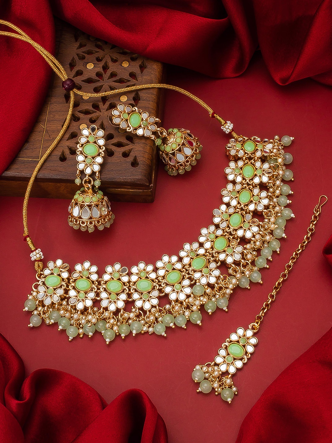 aadita Gold-Plated Green & White Stone-Studded & Pearl Beaded Handcrafted Jewellery Set
aadita Gold-Plated Green & White Stone-Studded & Pearl Beaded Handcrafted Jewellery Set