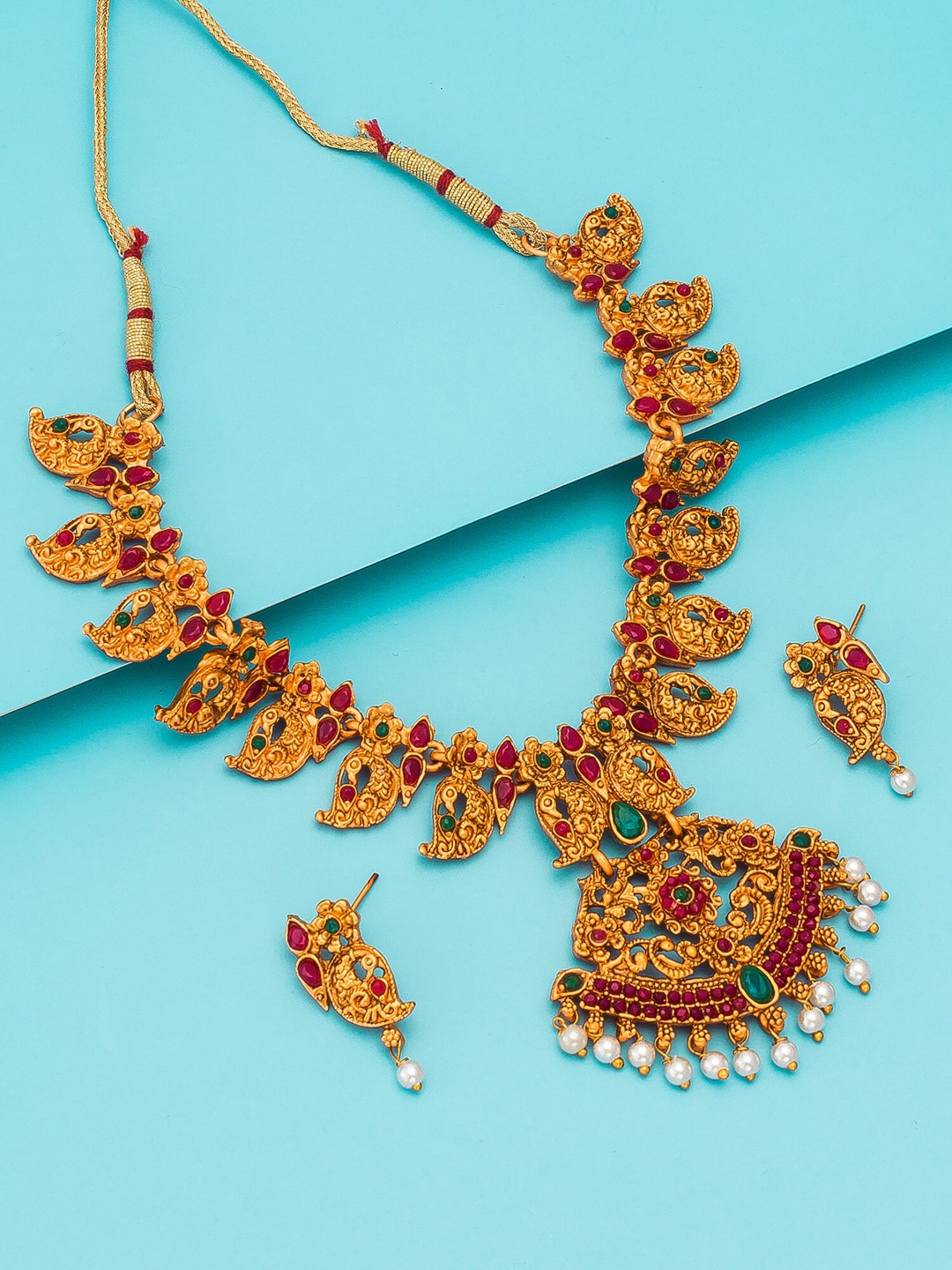 aadita Gold-Plated Pink & Green Stone Studded White Beaded Handcrafted Jewellery Set
aadita Gold-Plated Pink & Green Stone Studded White Beaded Handcrafted Jewellery Set
