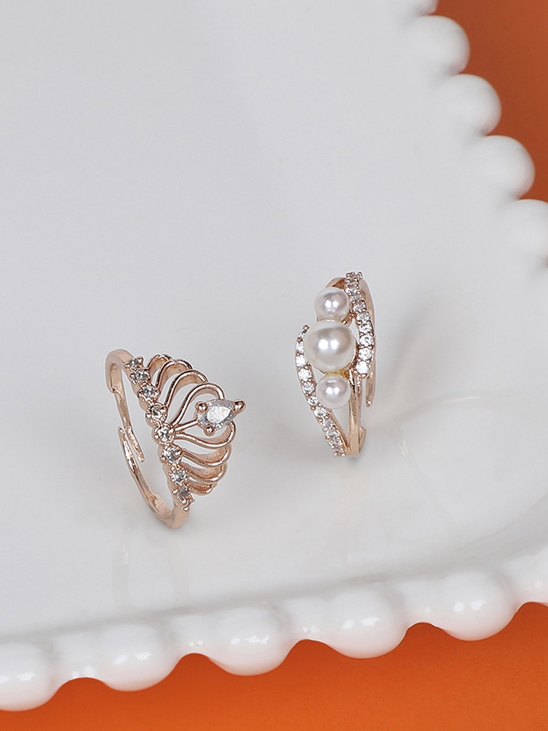 Zaveri Pearls Set Of 2 Rose Gold-Plated White CZ-Studded & Beaded Adjustable Contemporary Finger Rings
Zaveri Pearls Set Of 2 Rose Gold-Plated White CZ-Studded & Beaded Adjustable Contemporary Finger Rings
