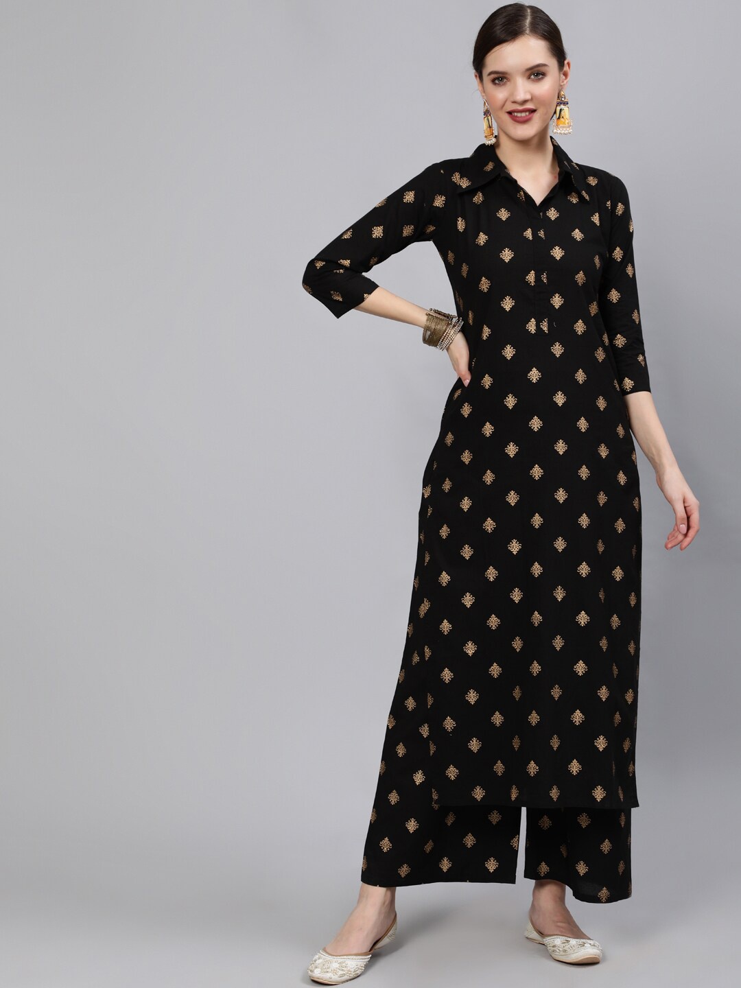 Nayo Women Black & Gold-Toned Ethnic Motifs Printed Regular Pure Cotton Kurta & Palazzos
Nayo Women Black & Gold-Toned Ethnic Motifs Printed Regular Pure Cotton Kurta & Palazzos