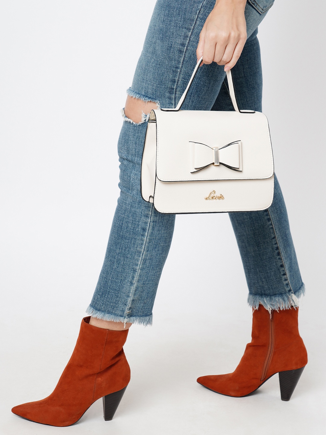 Lavie White PU Structured Handheld Bag Bow Detail With Detachable Sling Strap
Lavie White PU Structured Handheld Bag Bow Detail With Detachable Sling Strap