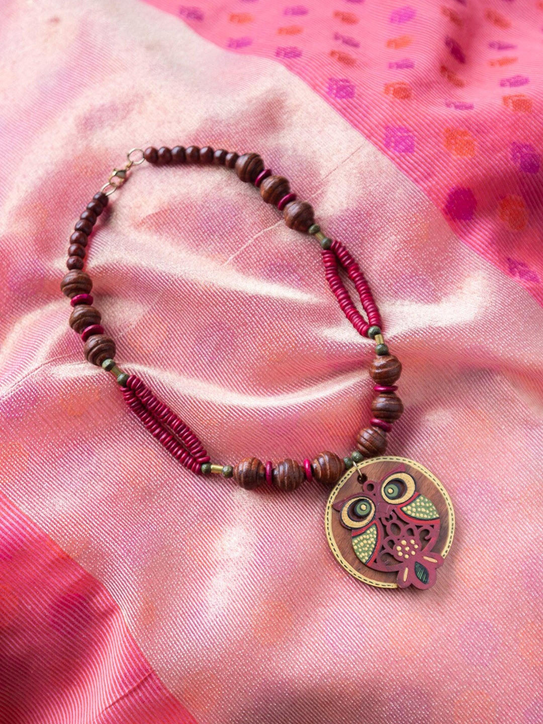 ExclusiveLane Symphony Of Owls Brown & Gold-Toned Bohemian Hand-Painted Wooden Necklace
ExclusiveLane Symphony Of Owls Brown & Gold-Toned Bohemian Hand-Painted Wooden Necklace
