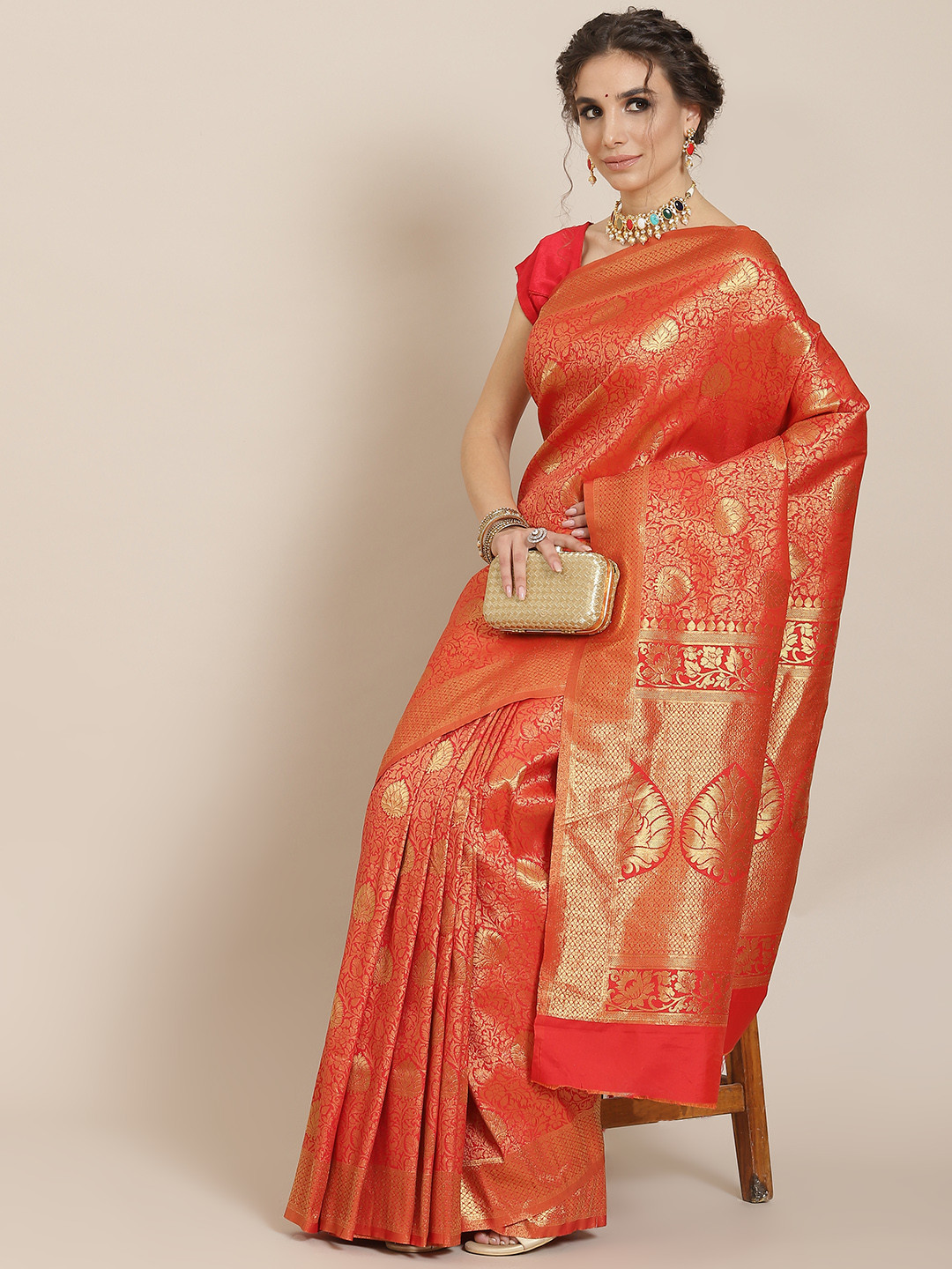SHARAA ETHNICA Orange Woven Design Zari Silk Blend Kanjeevaram Saree
SHARAA ETHNICA Orange Woven Design Zari Silk Blend Kanjeevaram Saree
