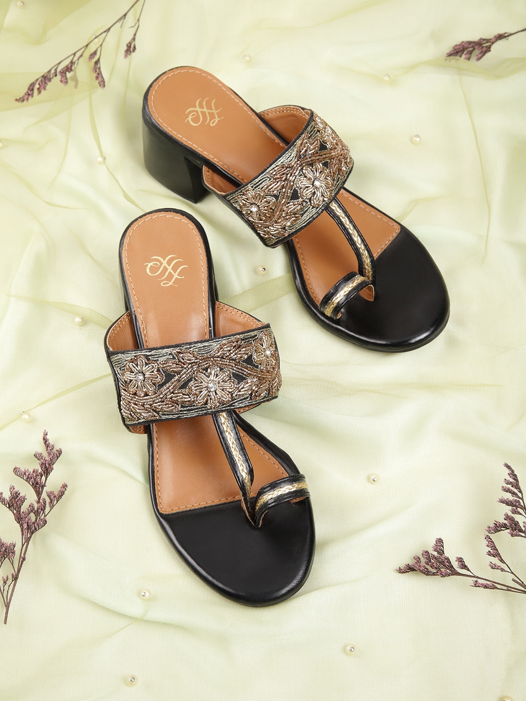 House of Pataudi Women Black & Gold-Toned Beads Embellished Leather Ethnic Block Heels
House of Pataudi Women Black & Gold-Toned Beads Embellished Leather Ethnic Block Heels