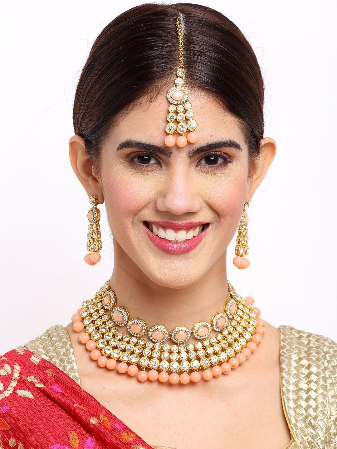 NEUDIS Gold-Plated White & Peach-Coloured Kundan-Studded & Pearl Beaded Jewellery Set
NEUDIS Gold-Plated White & Peach-Coloured Kundan-Studded & Pearl Beaded Jewellery Set