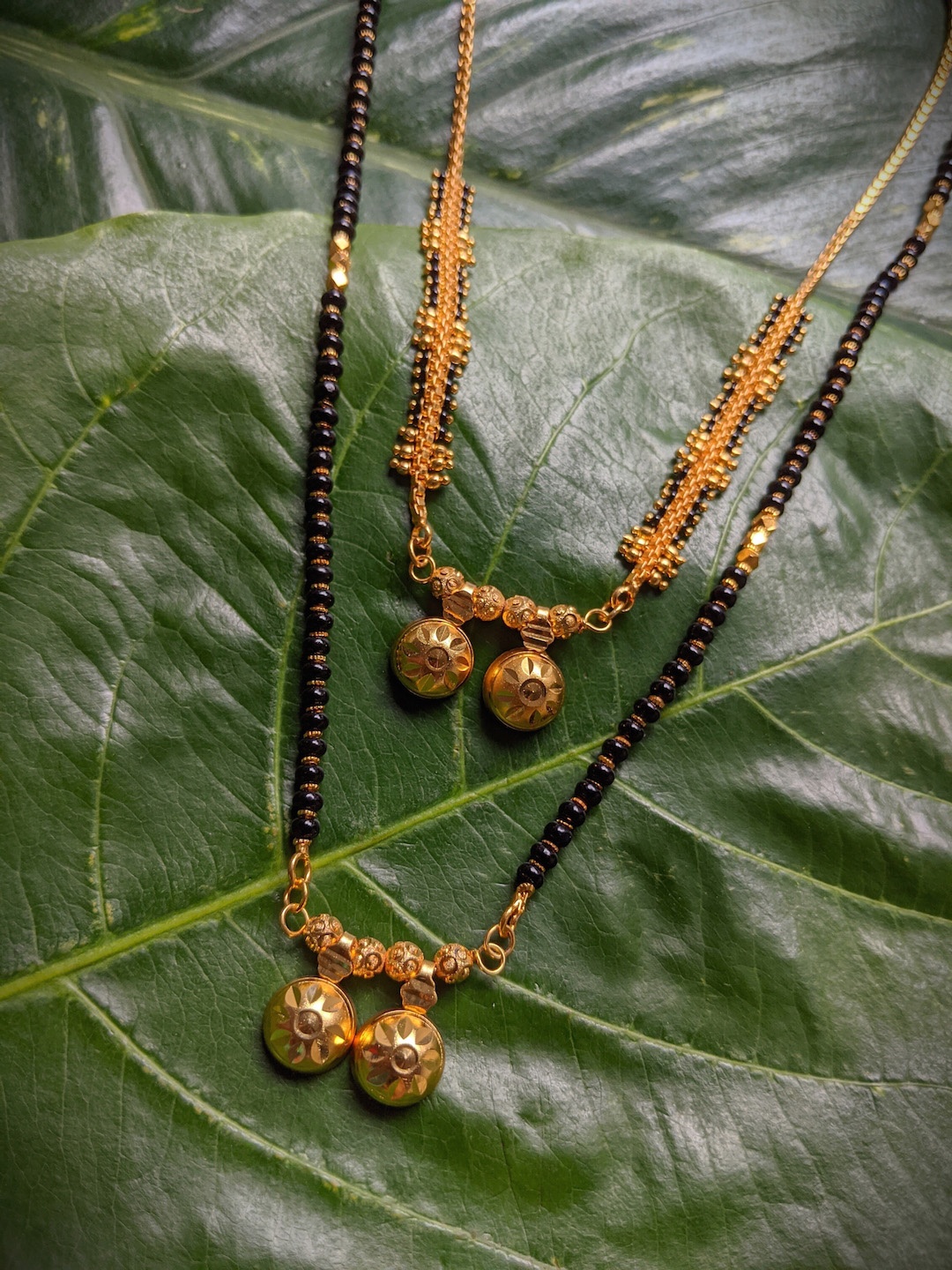 Digital Dress Room Set of 2 Women Black Gold Plated Vati Pendant South Indian Style Mangalsutra
Digital Dress Room Set of 2 Women Black Gold Plated Vati Pendant South Indian Style Mangalsutra
