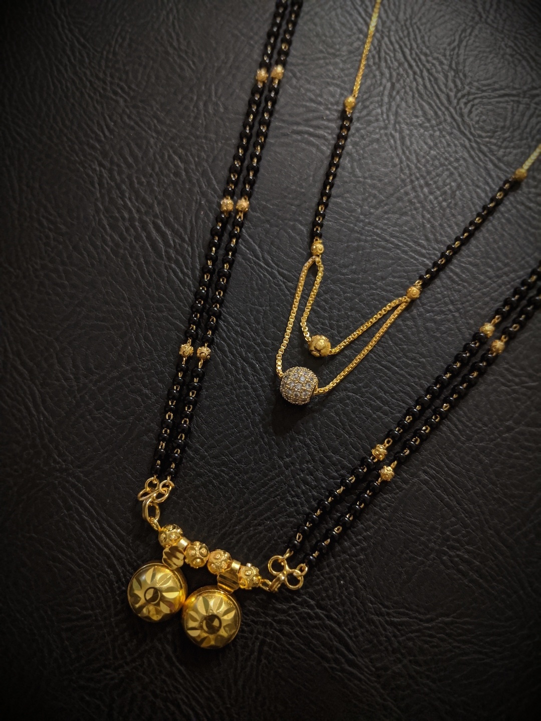 Digital Dress Room Set Of 2 Gold-Plated White & Black Stone-Studded & Beaded Mangalsutra
Digital Dress Room Set Of 2 Gold-Plated White & Black Stone-Studded & Beaded Mangalsutra