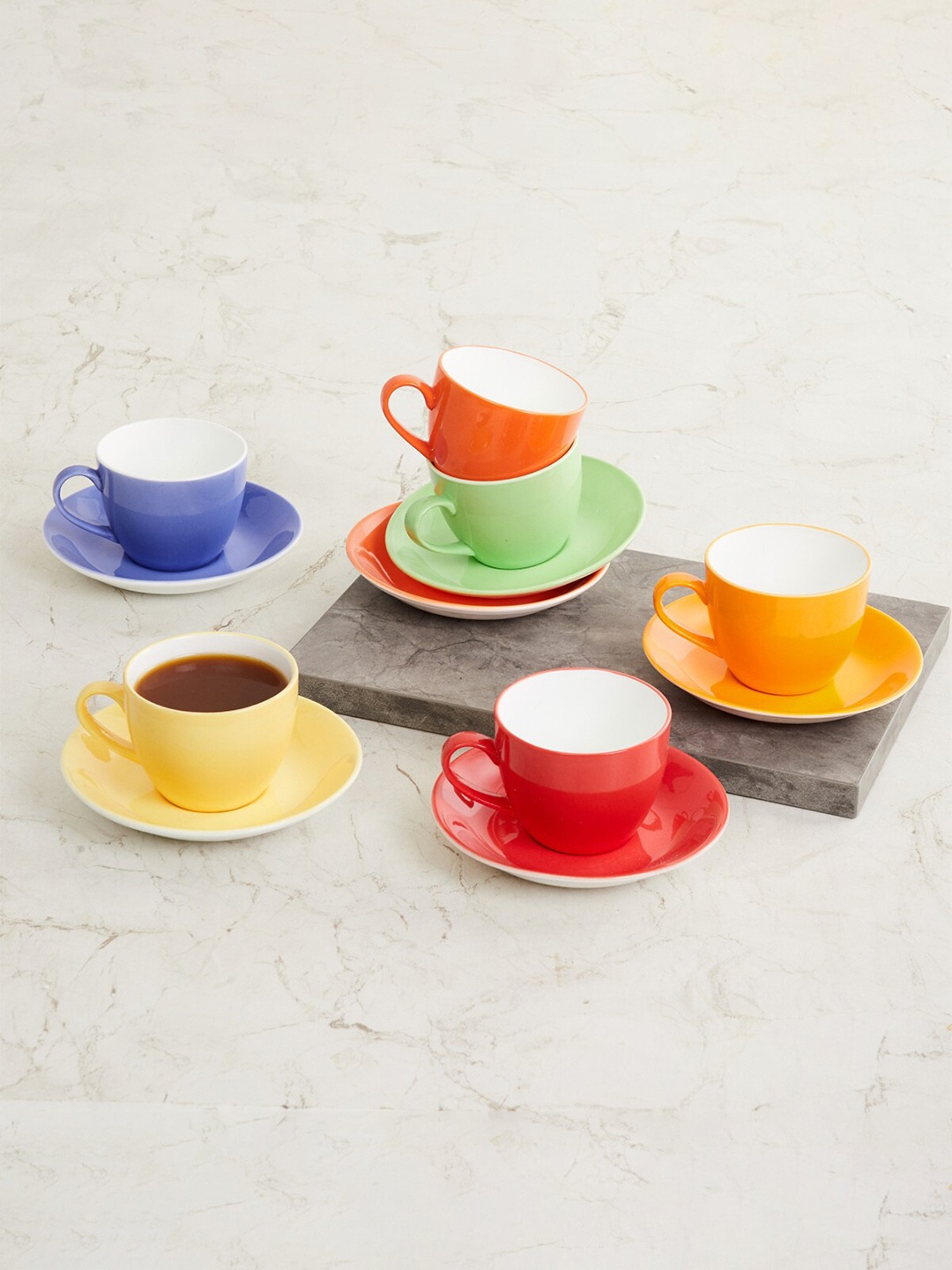 Home Centre 6 Pieces Multicoloured Solid Bone China Glossy Cups and Saucers Set, Multi
Home Centre 6 Pieces Multicoloured Solid Bone China Glossy Cups and Saucers Set, Multi