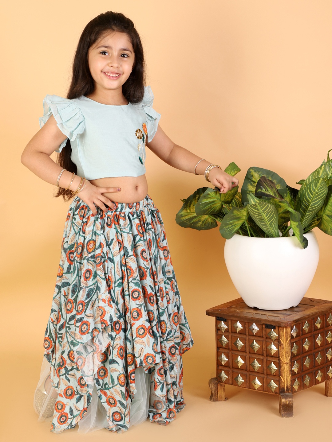 LIL DRAMA Girls Sea Green & Orange Embroidered Choli & Asymmetric Printed Lehenga Set, Blue
LIL DRAMA Girls Sea Green & Orange Embroidered Choli & Asymmetric Printed Lehenga Set, Blue