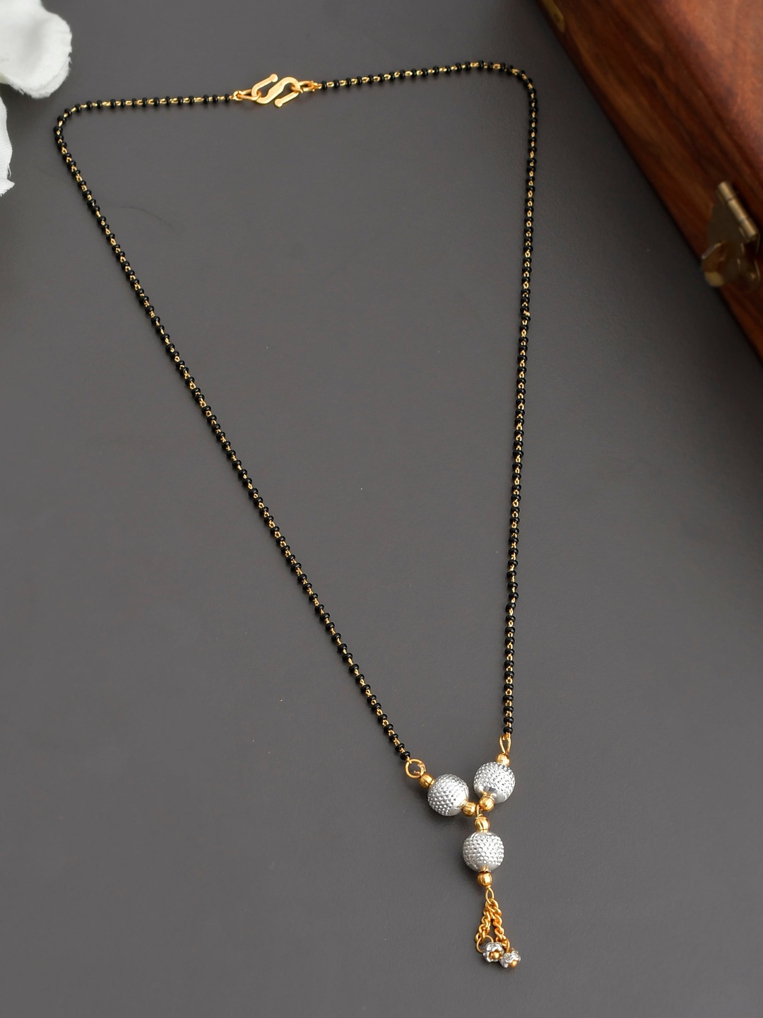 Silvermerc Designs Gold-Plated Black & White Beads & Stones-Studded Tridevi Solitaire Mangalsutra
Silvermerc Designs Gold-Plated Black & White Beads & Stones-Studded Tridevi Solitaire Mangalsutra