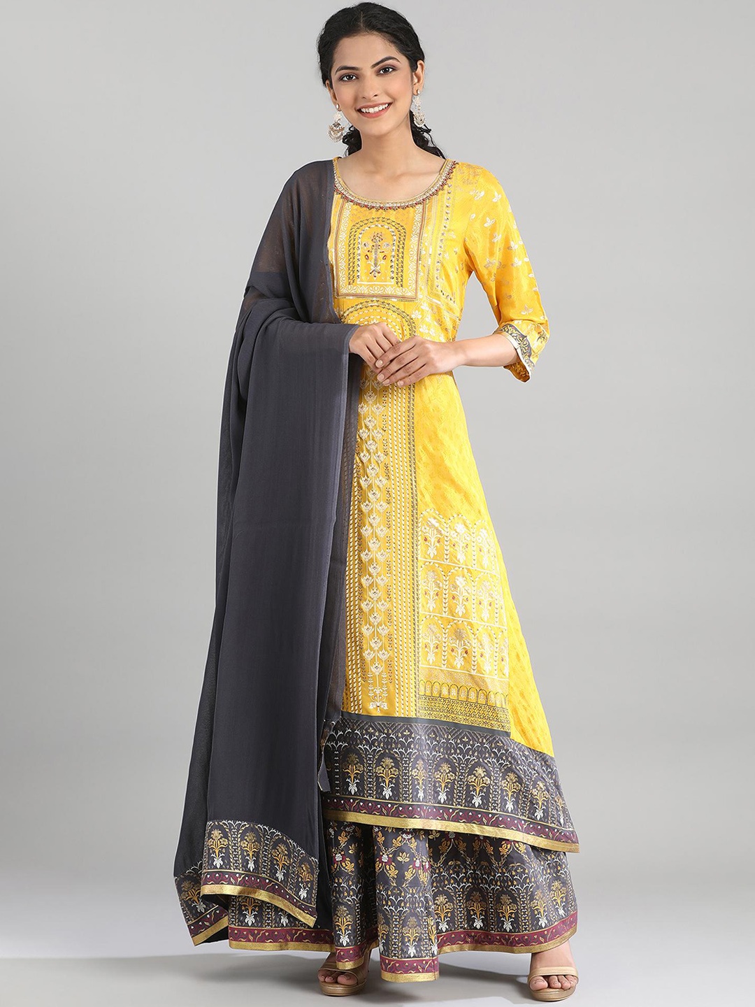 AURELIA Women Yellow Ethnic Motifs Printed Beads and Stones Kurta with Skirt & With Dupatta
AURELIA Women Yellow Ethnic Motifs Printed Beads and Stones Kurta with Skirt & With Dupatta