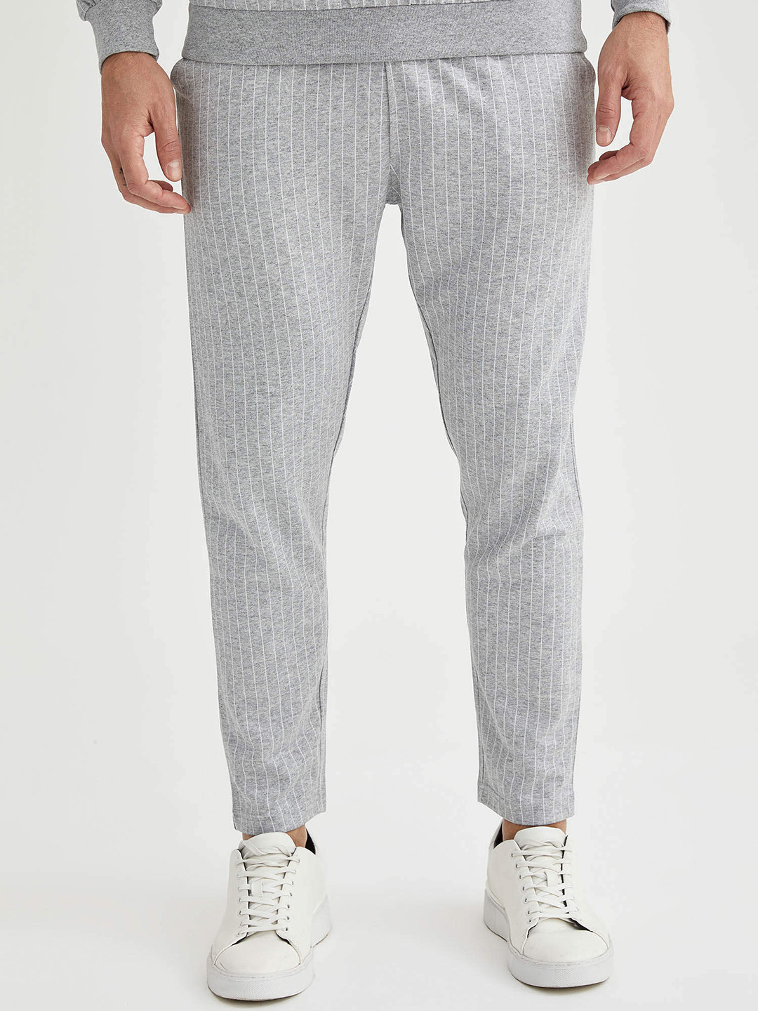 DeFacto Men Grey Melange & White Slim Fit Striped Knit Crop Track Pants 
DeFacto Men Grey Melange & White Slim Fit Striped Knit Crop Track Pants
