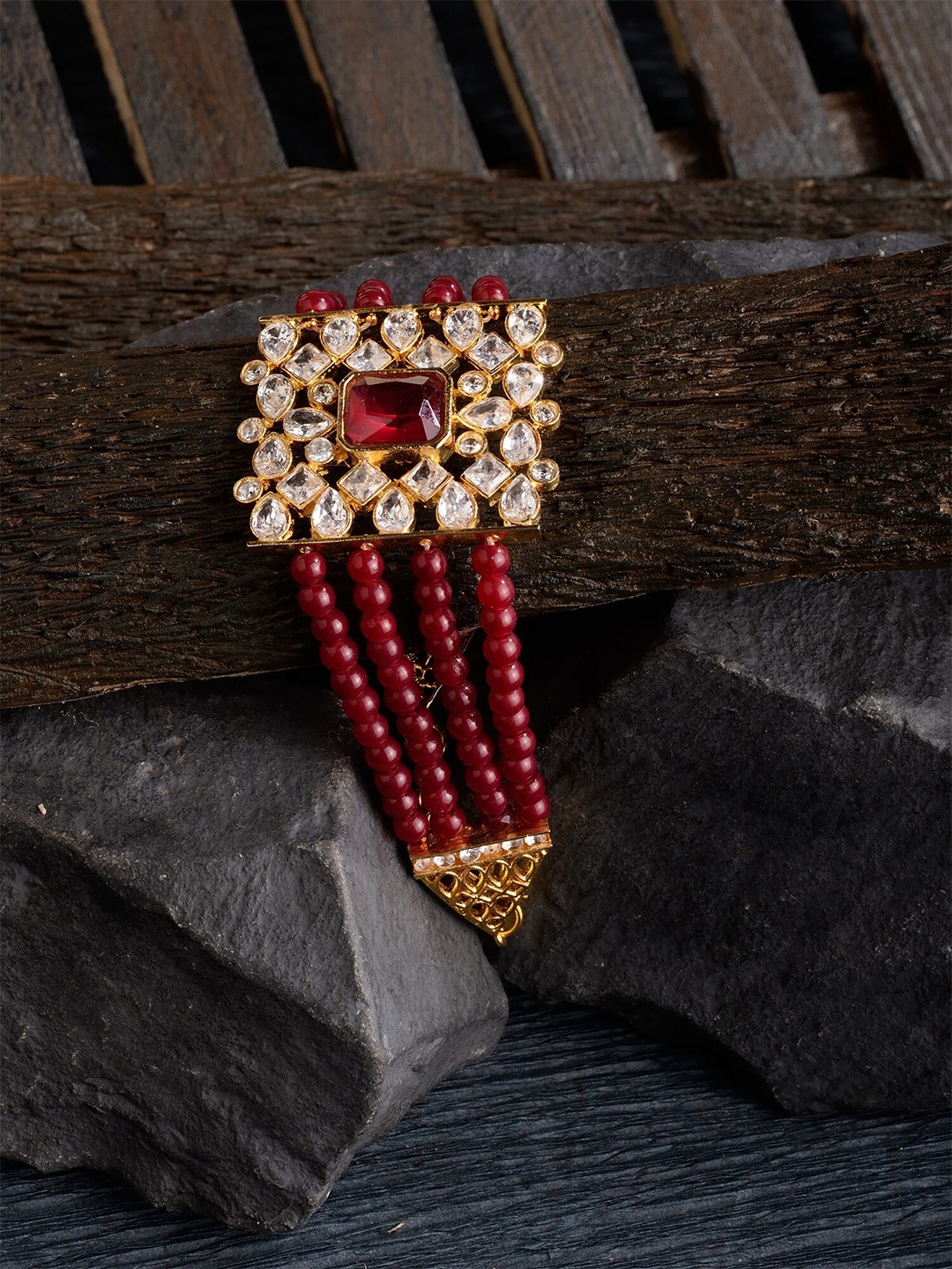 Saraf RS Jewellery Gold-Toned & Maroon Stones & Beaded Brass Gold-Plated Link Bracelet
Saraf RS Jewellery Gold-Toned & Maroon Stones & Beaded Brass Gold-Plated Link Bracelet