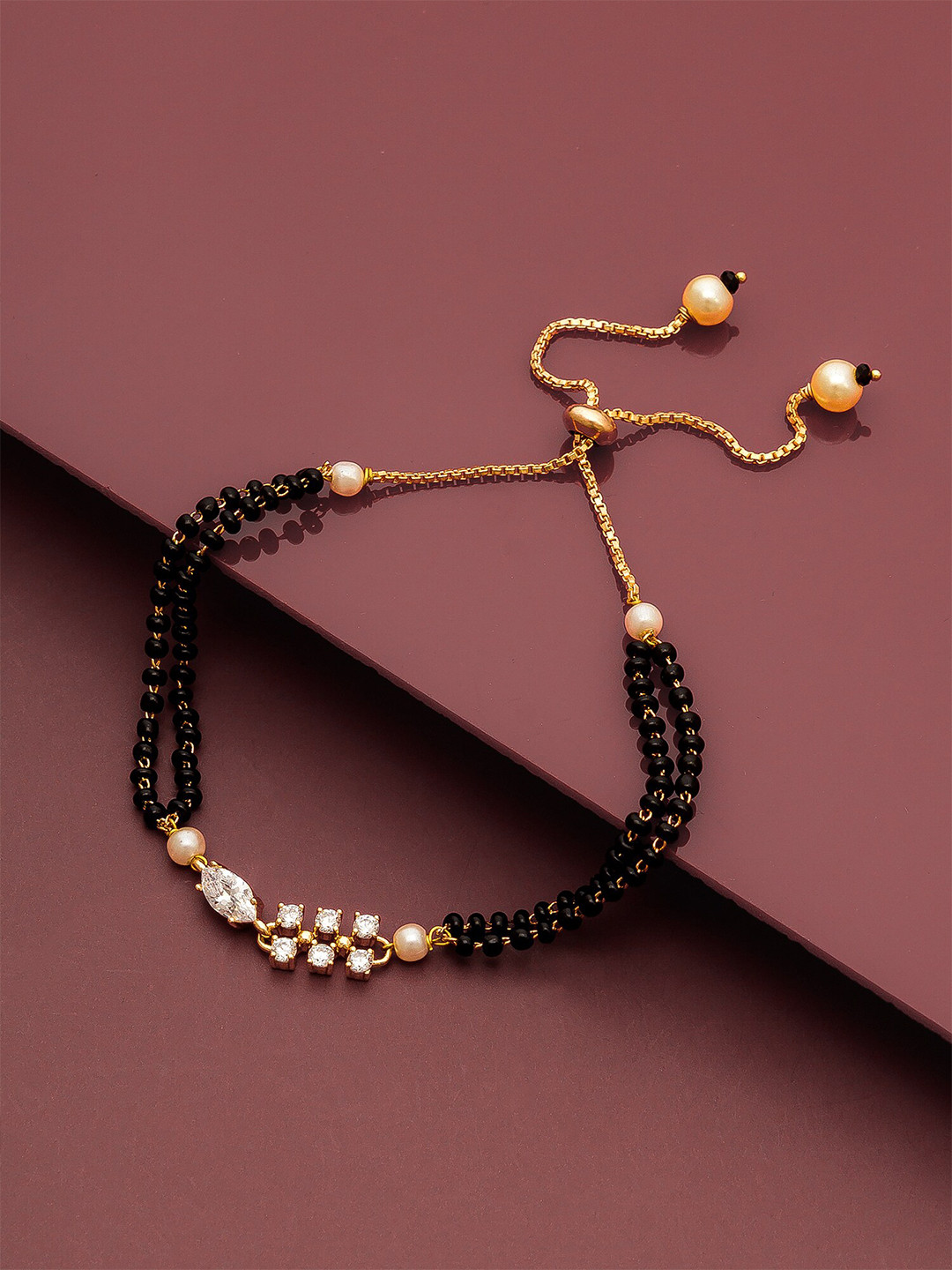 aadita Women Gold-Toned & Black Brass American Diamond Handcrafted Gold-Plated Link Bracelet
aadita Women Gold-Toned & Black Brass American Diamond Handcrafted Gold-Plated Link Bracelet