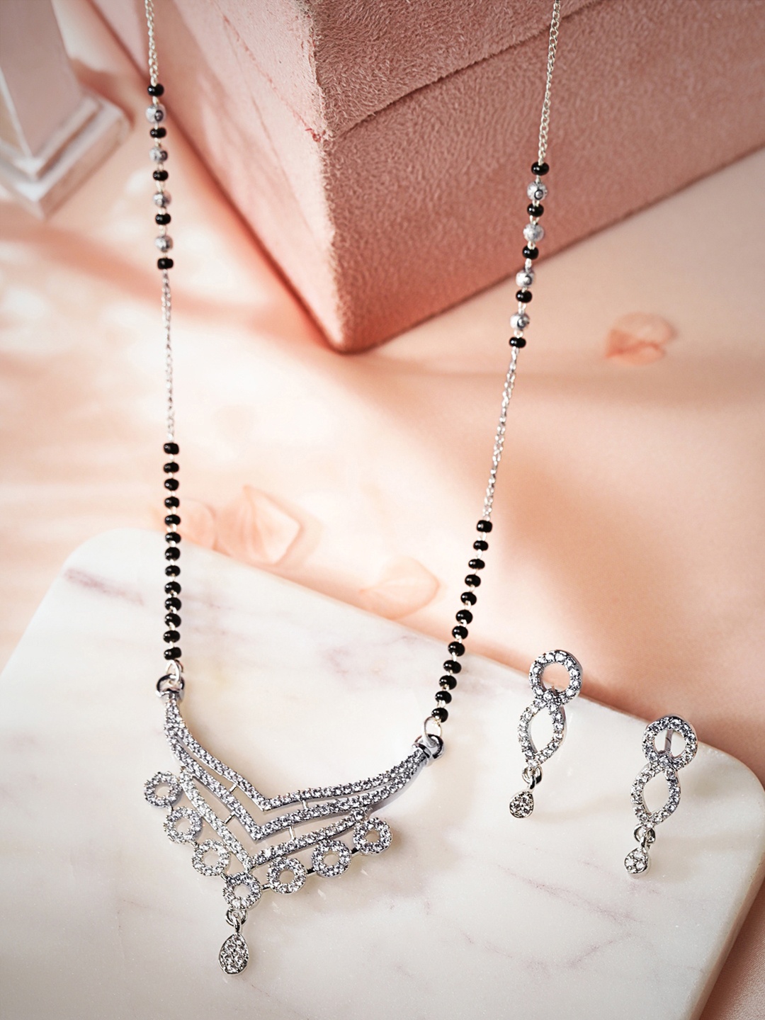 Rubans Rhodium Plated in Silver Tone Black Beaded & AD Zirconia Studded Mangalsutra Set
Rubans Rhodium Plated in Silver Tone Black Beaded & AD Zirconia Studded Mangalsutra Set