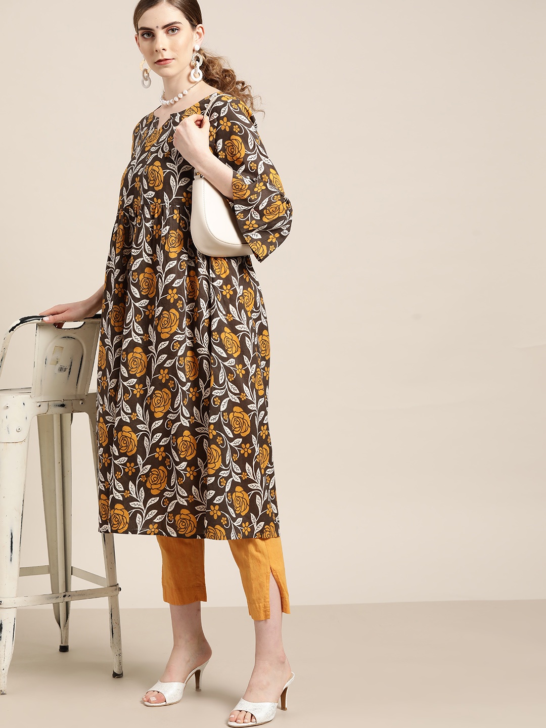 Moda Rapido Women Taupe & Mustard Yellow Cotton Floral Printed Bell Sleeves A-Line Kurta
Moda Rapido Women Taupe & Mustard Yellow Cotton Floral Printed Bell Sleeves A-Line Kurta