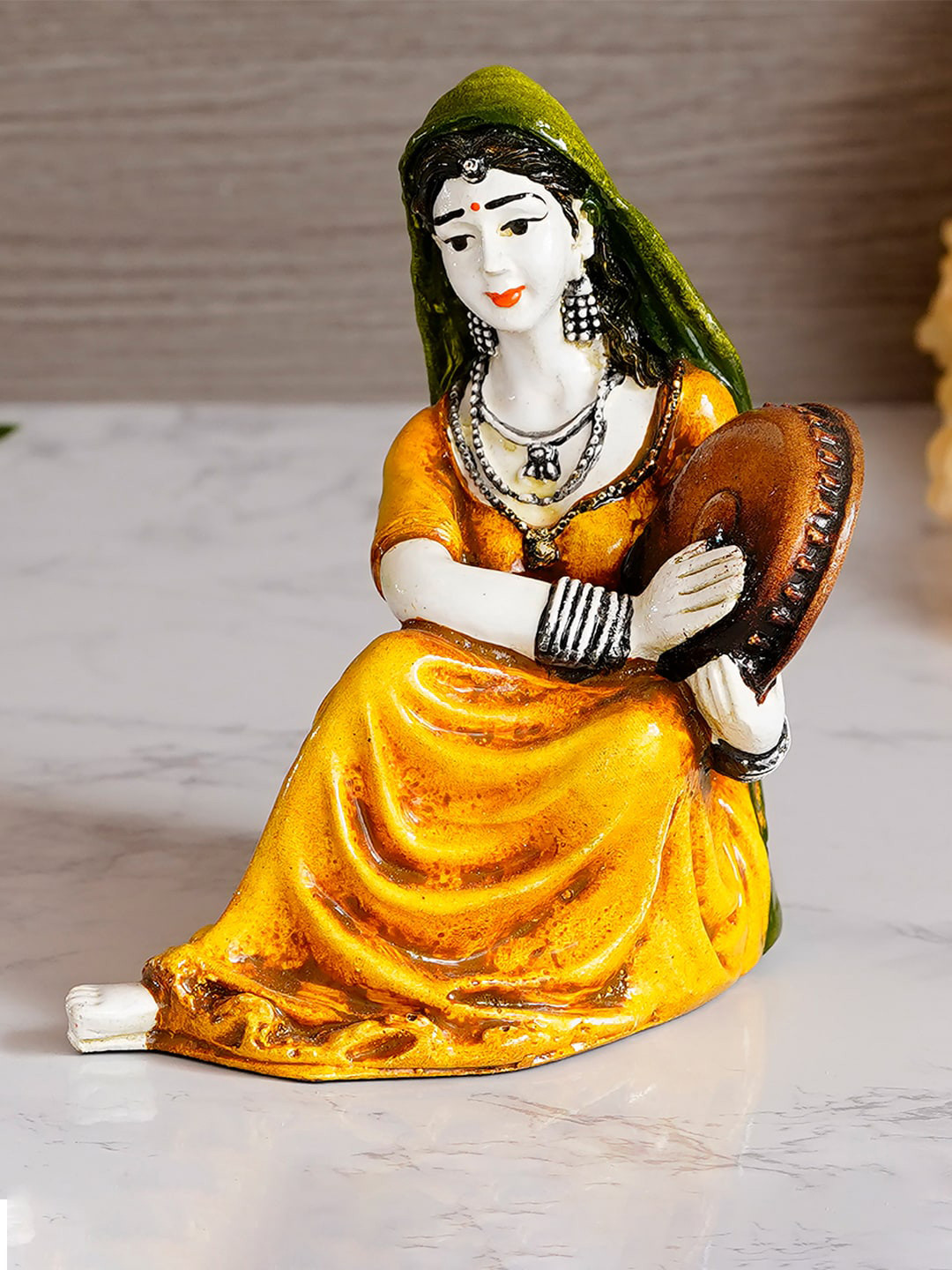 eCraftIndia Yellow & Green Polyresin Rajasthani Lady Playing Musical Instrument Showpiece
eCraftIndia Yellow & Green Polyresin Rajasthani Lady Playing Musical Instrument Showpiece