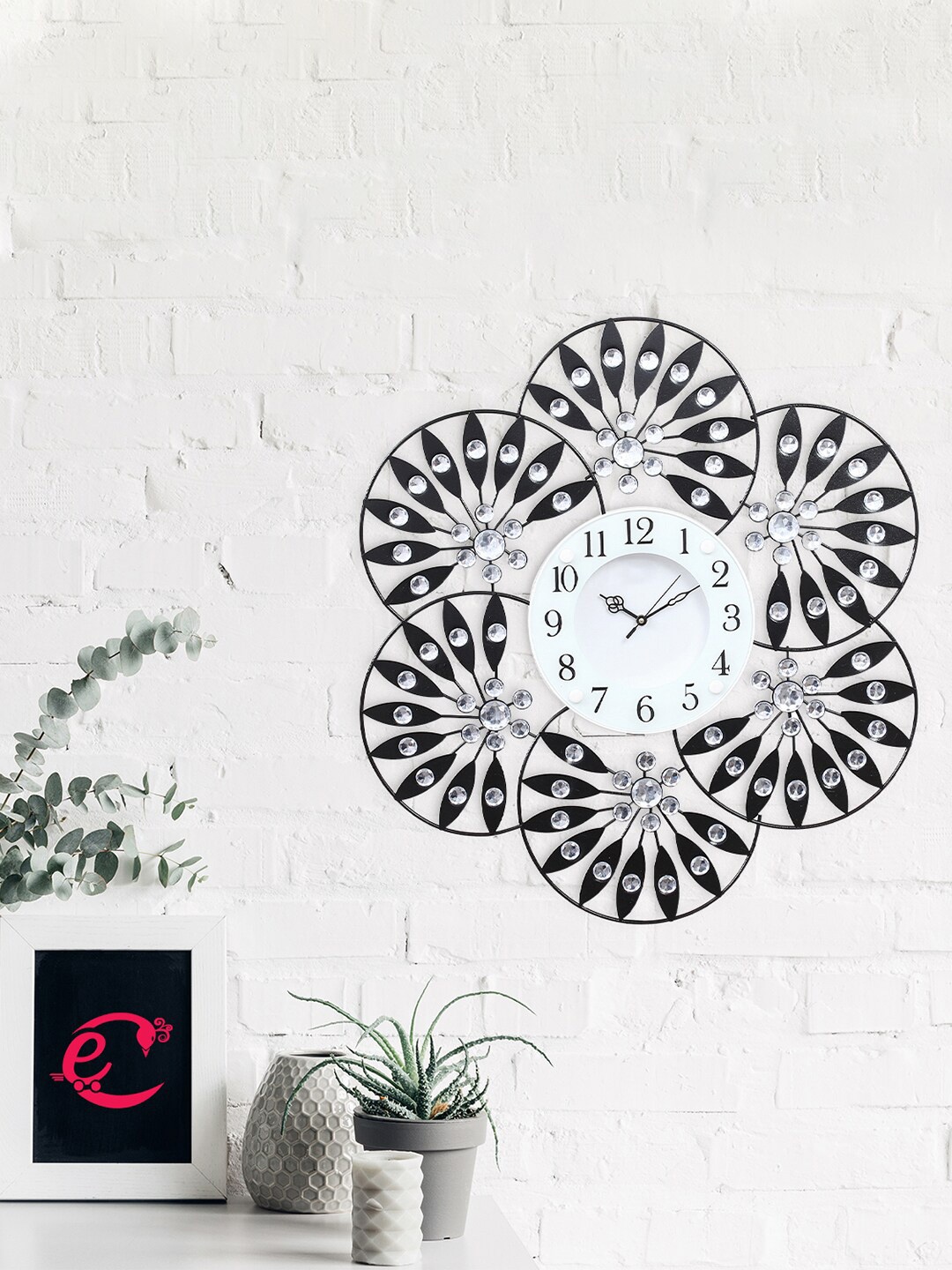 eCraftIndia Black & Silver-Toned Embellished Contemporary Stone Series Round Wall Clock
eCraftIndia Black & Silver-Toned Embellished Contemporary Stone Series Round Wall Clock