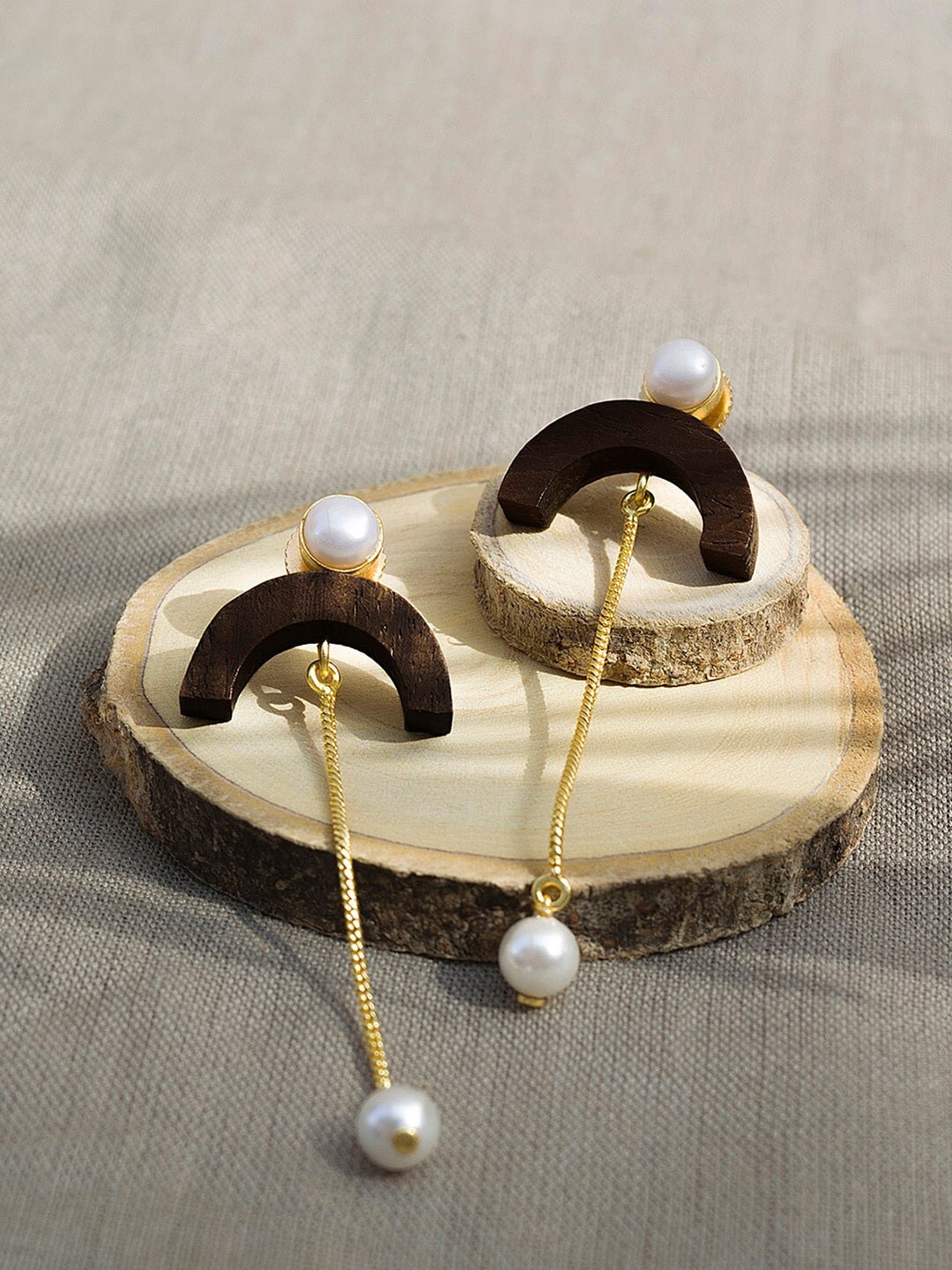 Mikoto by FableStreet Woman Gold-Toned Recycled Wood C Danglers with Pearl Drop Earrings
Mikoto by FableStreet Woman Gold-Toned Recycled Wood C Danglers with Pearl Drop Earrings