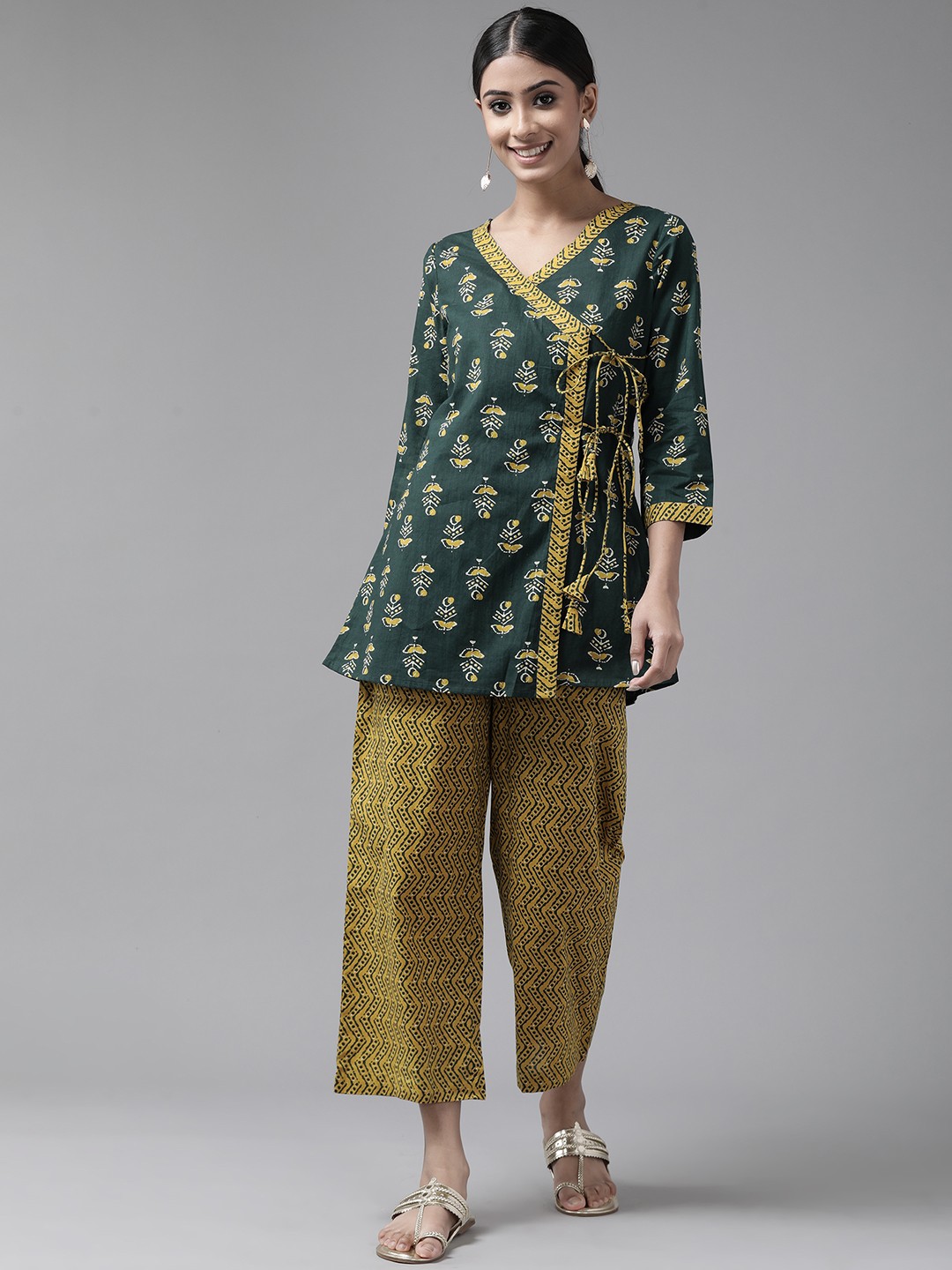 Amirah s Women Green & Mustard Ethnic Motifs Printed Angrakha Cotton Kurti with Palazzos
Amirah s Women Green & Mustard Ethnic Motifs Printed Angrakha Cotton Kurti with Palazzos